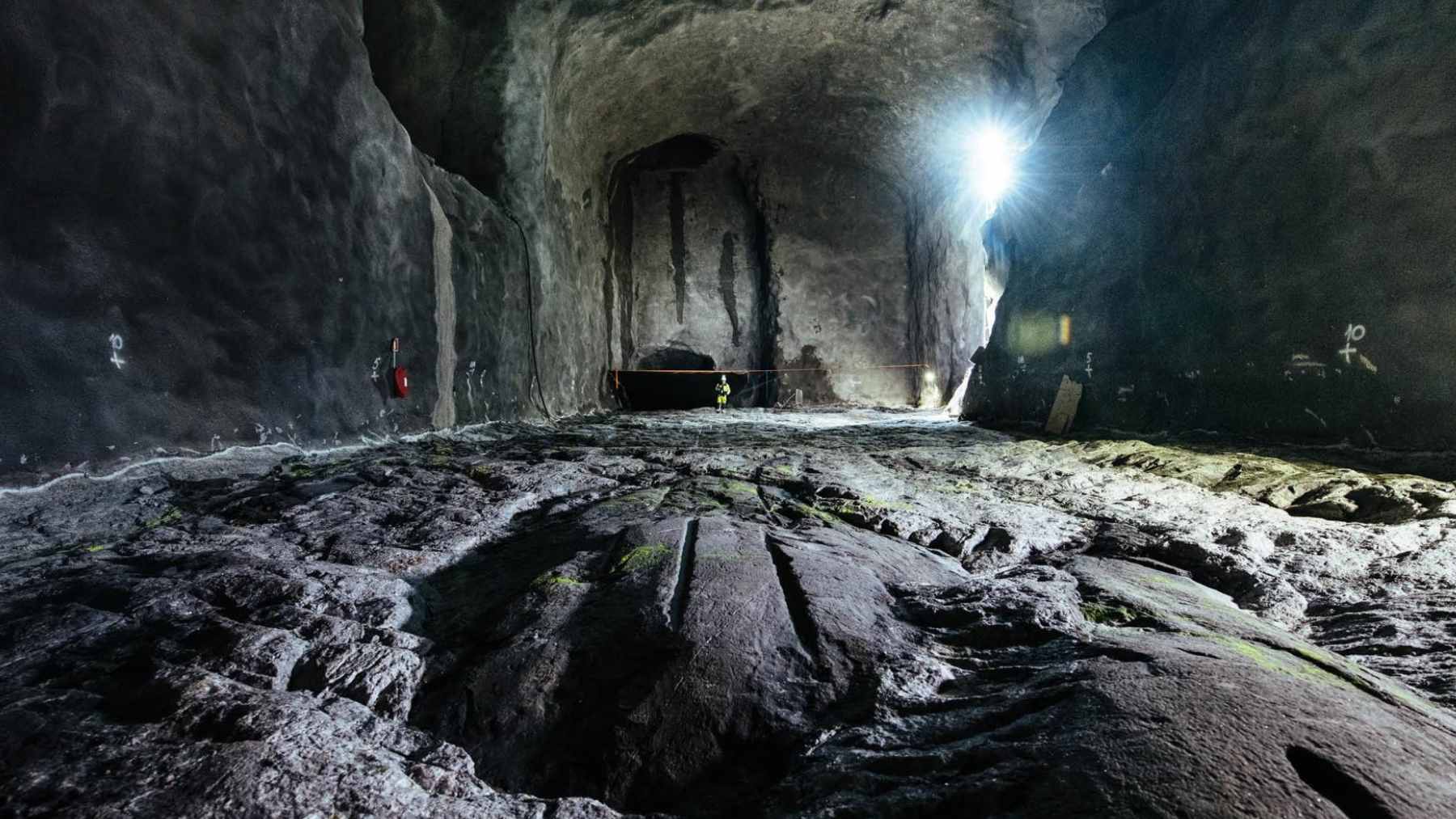 The main tunnel entrance and automated transport machinery at the Onkalo deep geological repository on Olkiluoto Island, Finland.