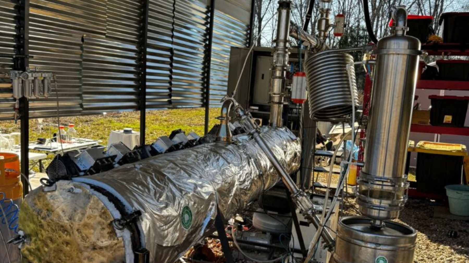 A prototype microwave-assisted pyrolysis reactor built by Julian Brown to convert plastic waste into liquid hydrocarbon fuel.