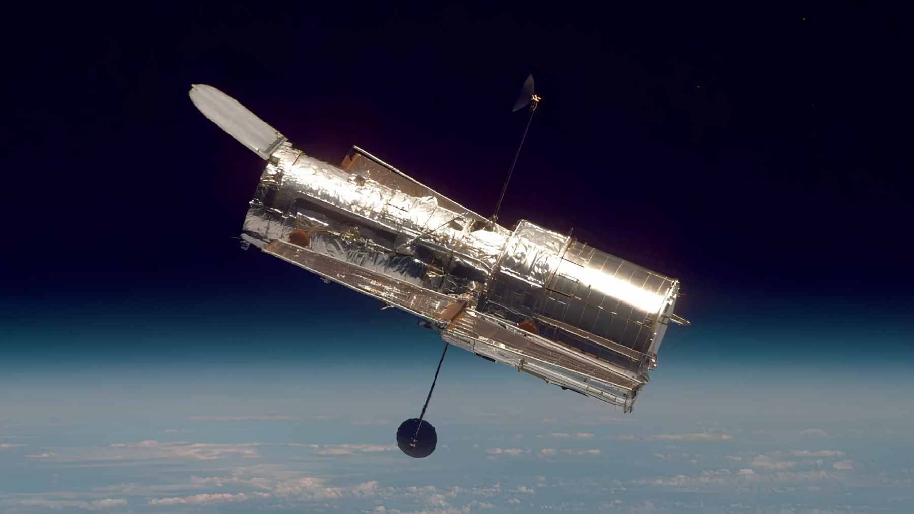 Artist rendering of a KH-11 reconnaissance satellite in low Earth orbit, monitoring surface activity from space.
