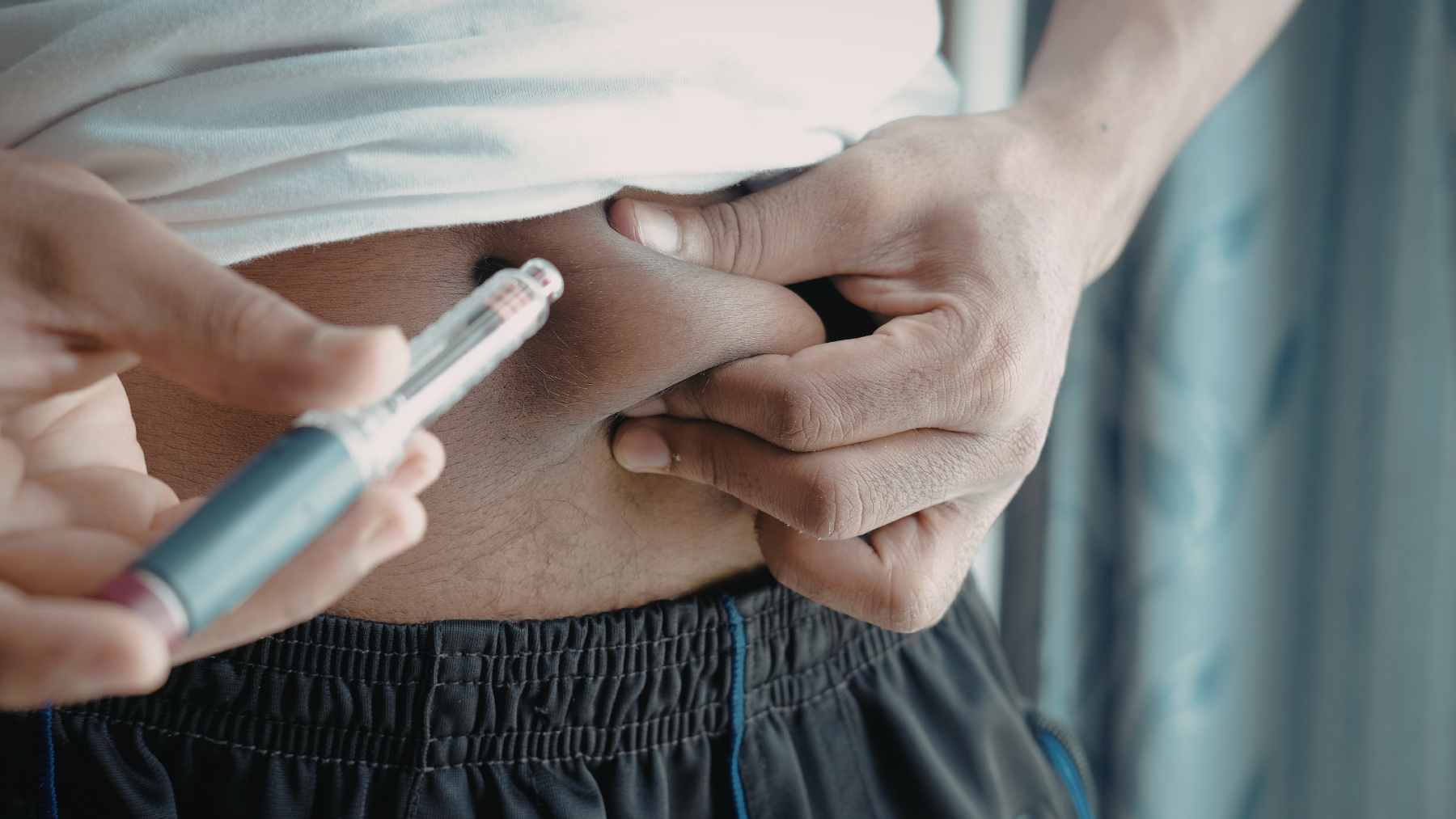 A microscopic view of an artificial pancreas implant featuring a protective crystalline shield for insulin-producing cells.