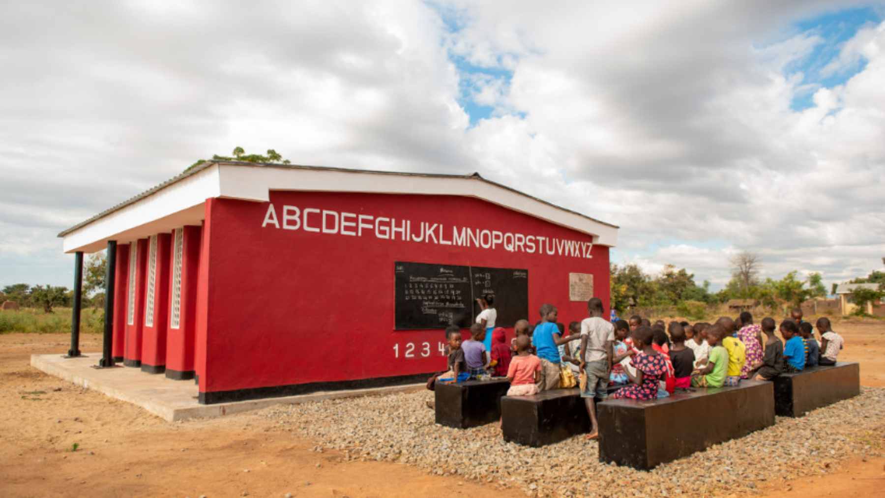A 3D concrete printing robot layering walls for a new school classroom in the Salima district of Malawi.