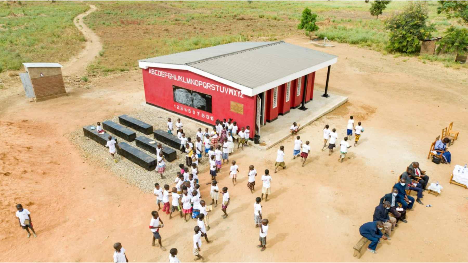 A 3D concrete printing robot layering walls for a new school classroom in the Salima district of Malawi.