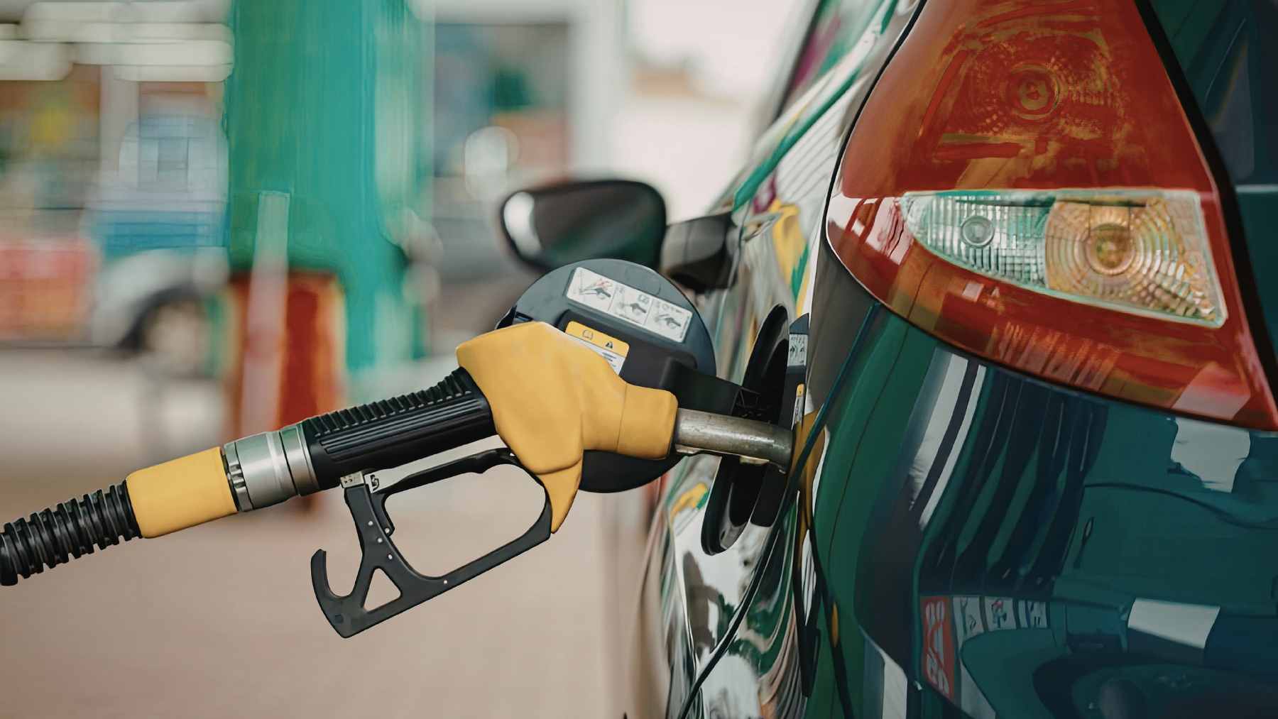 A close-up of a fuel pump dispensing the new B50 biodiesel, a 50% palm oil mix, into a commercial vehicle in Indonesia.