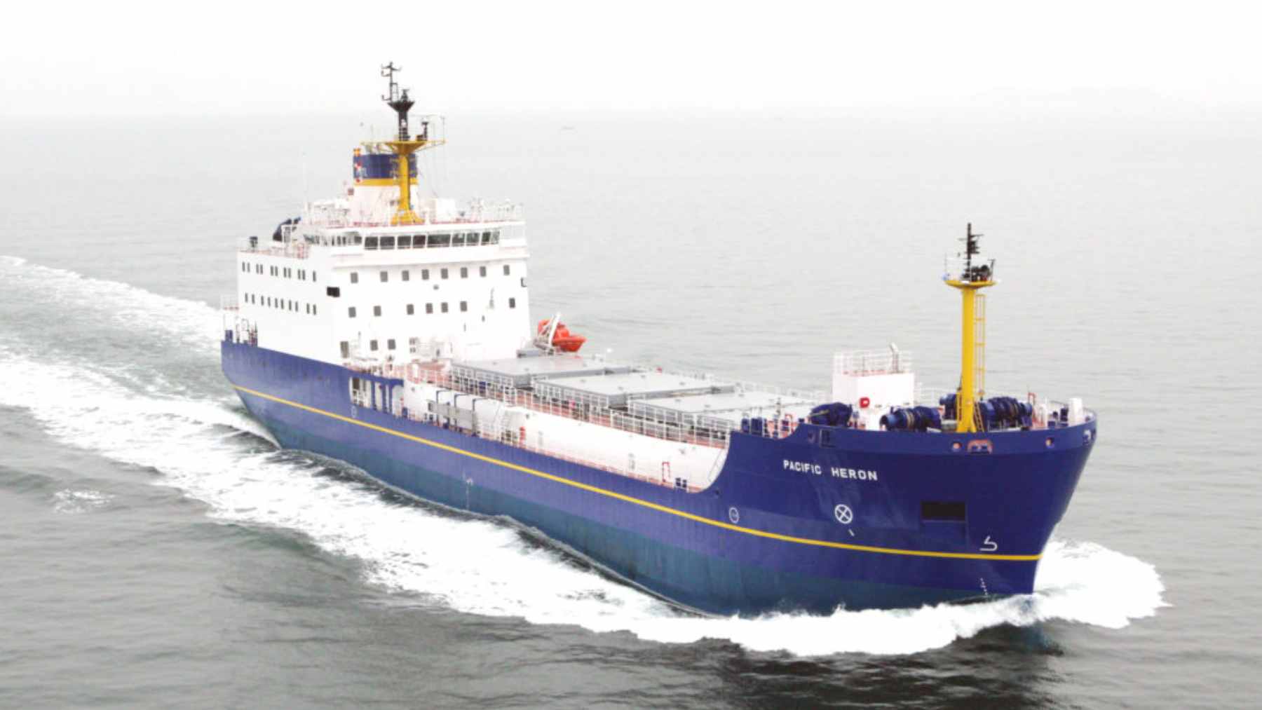 The Pacific Grebe vessel docked at a marine terminal during the test fitting of the massive 150-ton TN Eagle nuclear fuel container.
