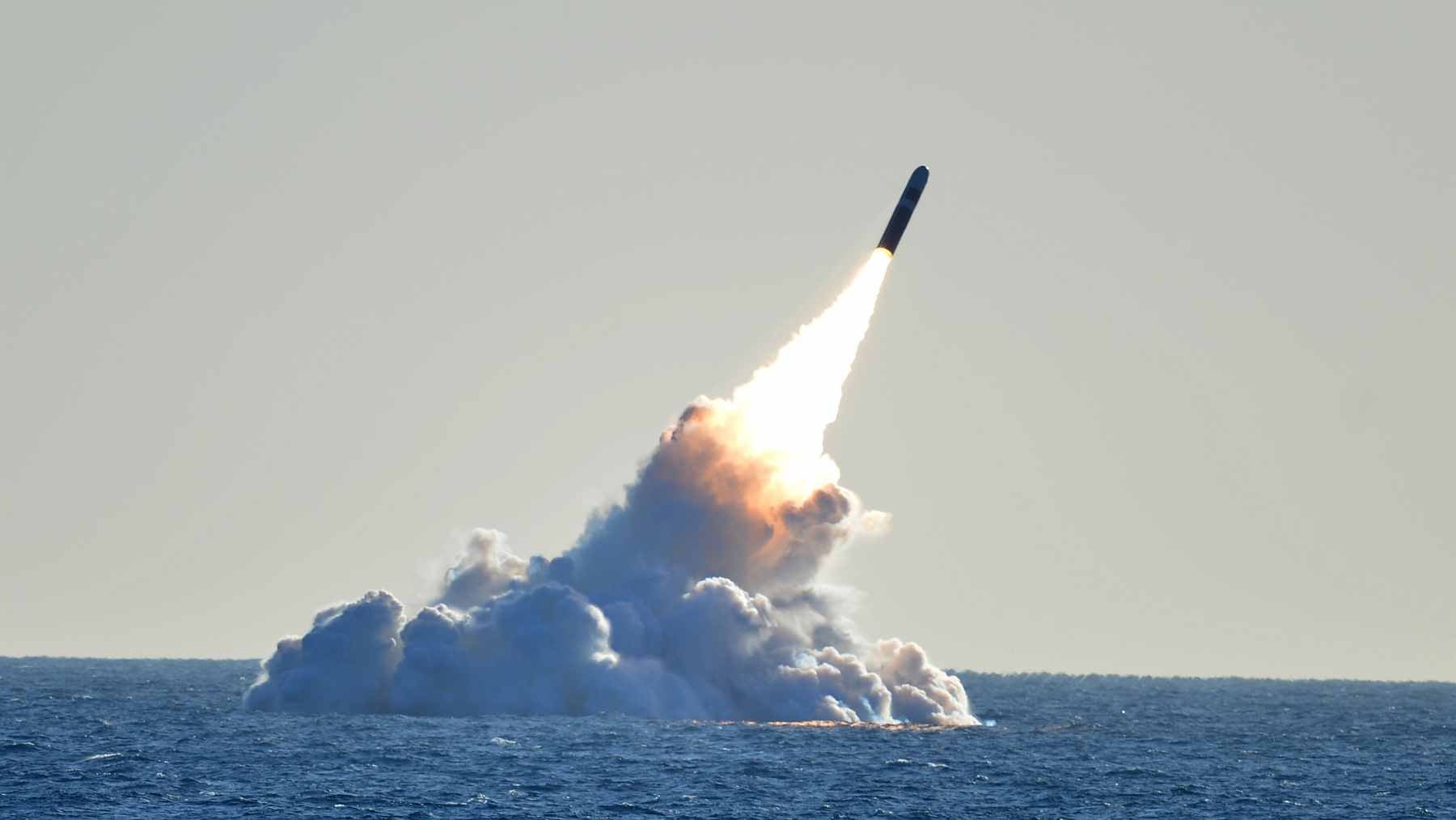 A containerized launcher system capable of deploying multiple low-cost cruise missiles from a standard shipping container.