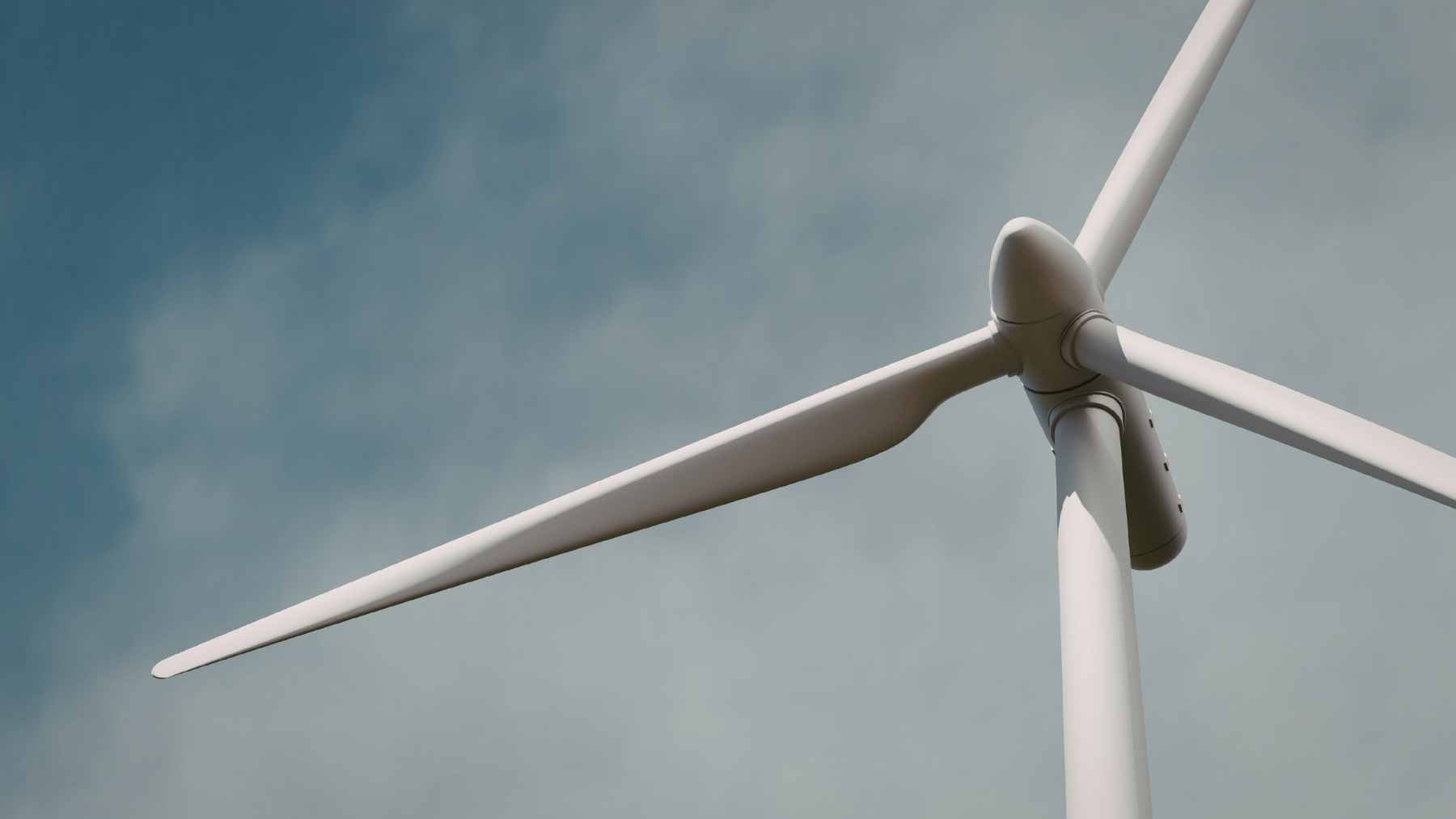 Massive wind turbines towering over a thriving cornfield in the rural Midwest, illustrating dual-use agricultural land.