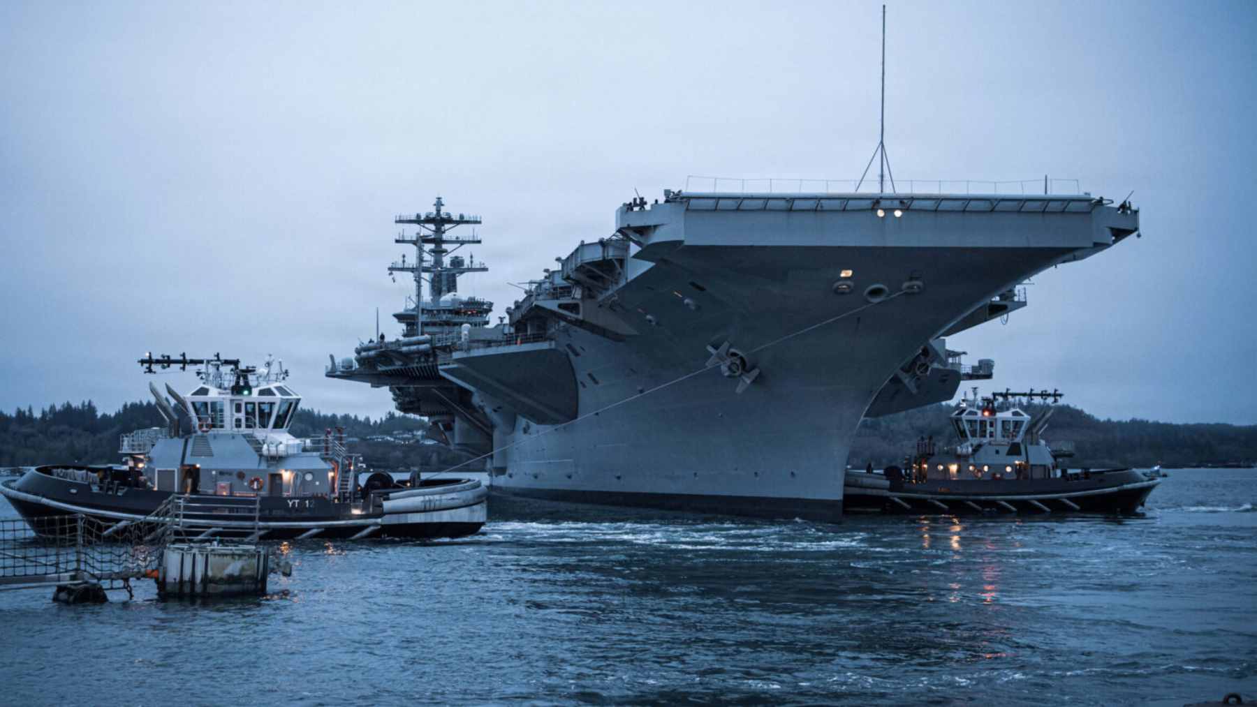 The USS Nimitz (CVN 68) aircraft carrier sailing at sea during its final years of active service.