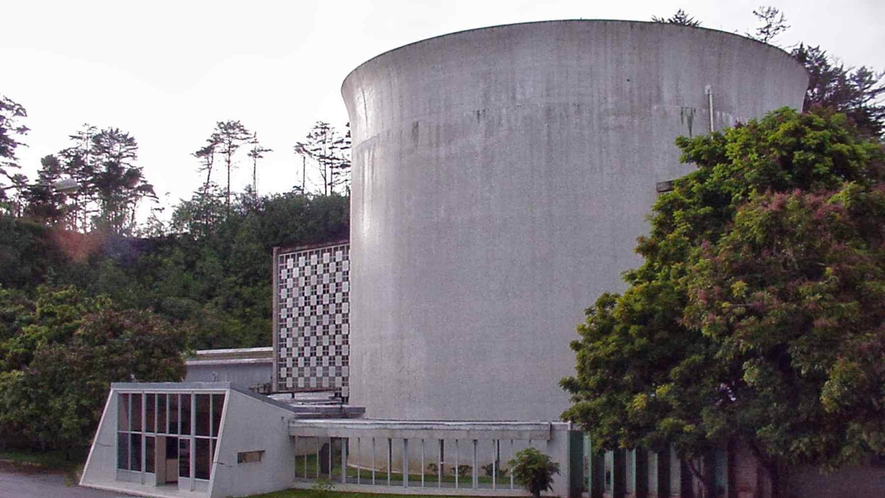 A heavy, secure nuclear spent fuel cask being monitored during a high-stakes transport operation from Venezuela.
