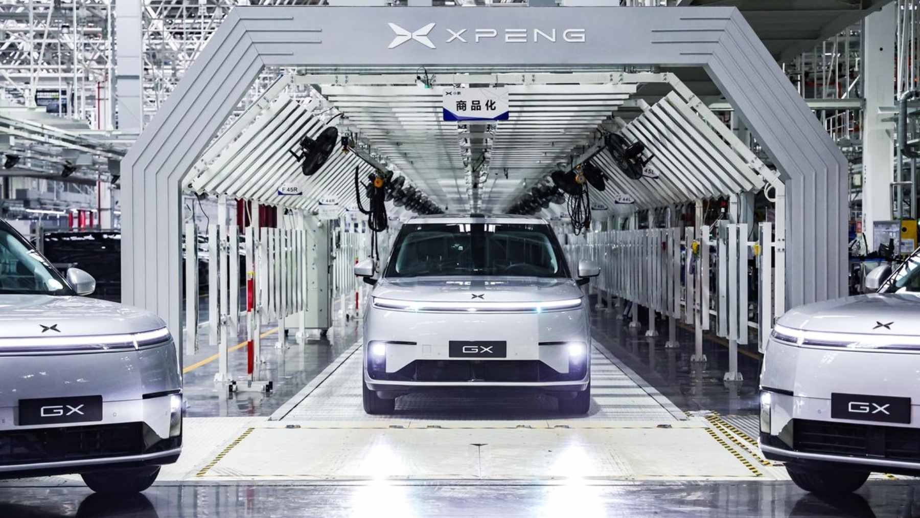 The first mass-produced XPENG L4 robotaxi rolling off the assembly line in Guangzhou, featuring a sensor-heavy pure-vision design.