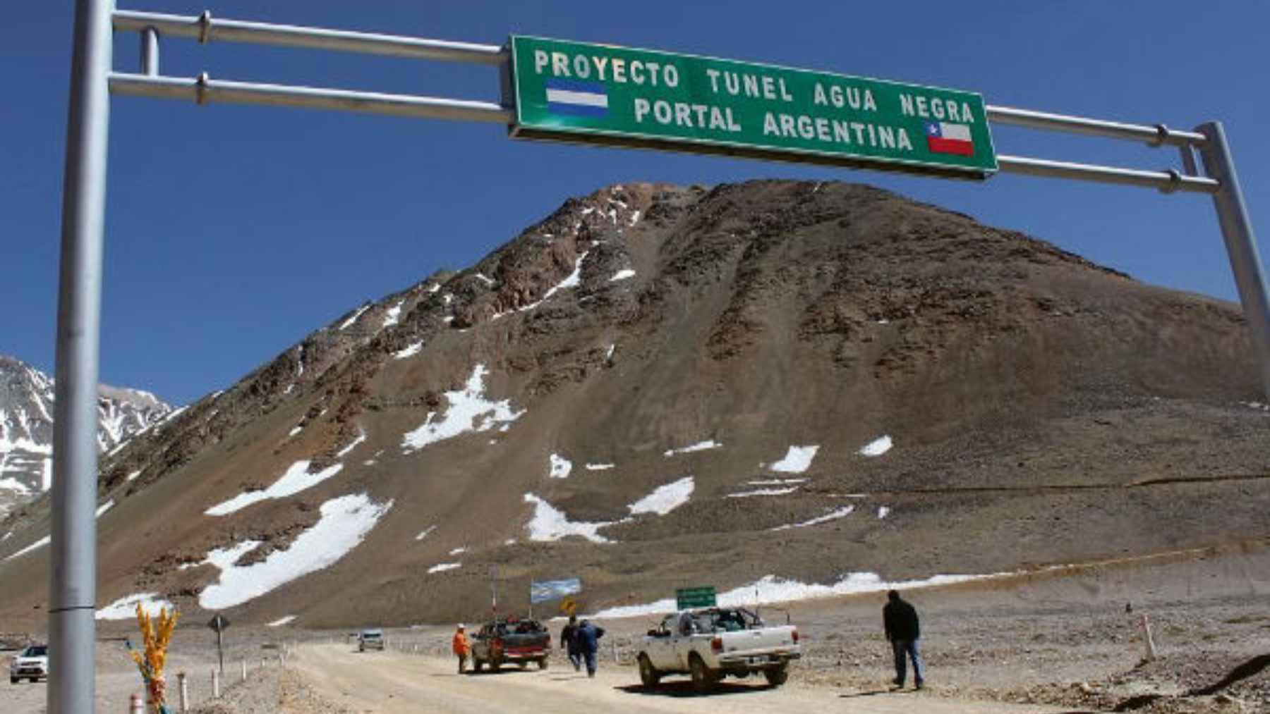 An engineering rendering of the proposed Agua Negra Tunnel, showing two parallel tunnels drilled deep beneath the Andes mountain peaks.