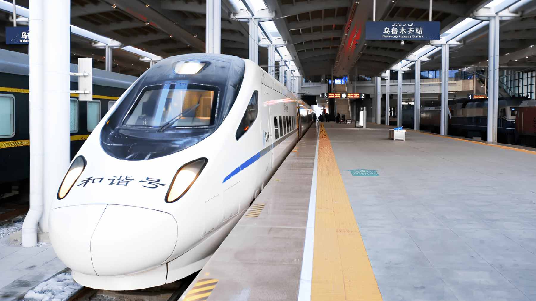 A sleek high-speed D-series train departing from Beijing, marking the new direct high-speed service to the Urumqi region.