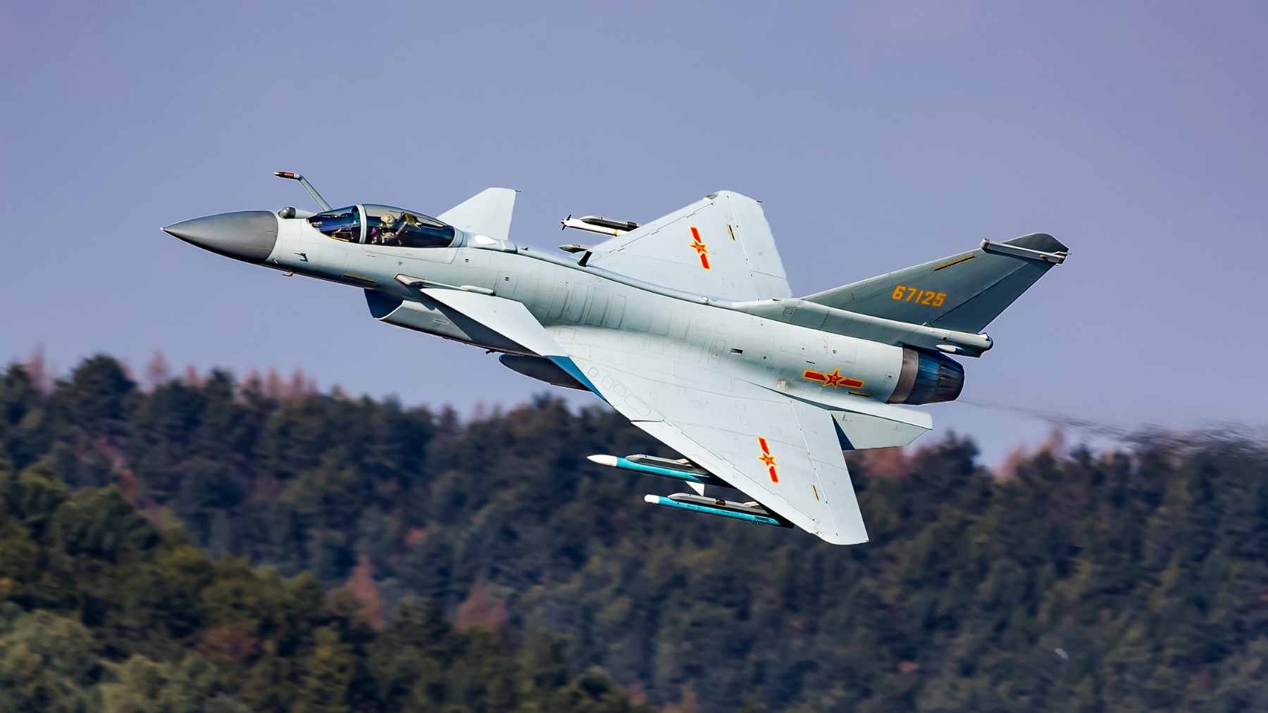 A Chinese Chengdu J-10B fighter jet performing a maneuver during a military exhibition, showcasing its modern avionics and airframe design.