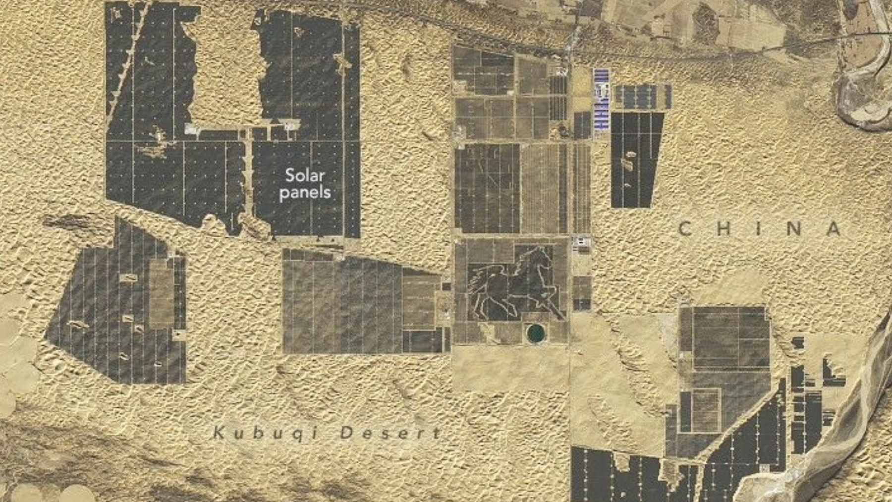 An aerial view of the massive solar panel arrays in China's Kubuqi Desert, forming part of the expansive Solar Great Wall energy project.