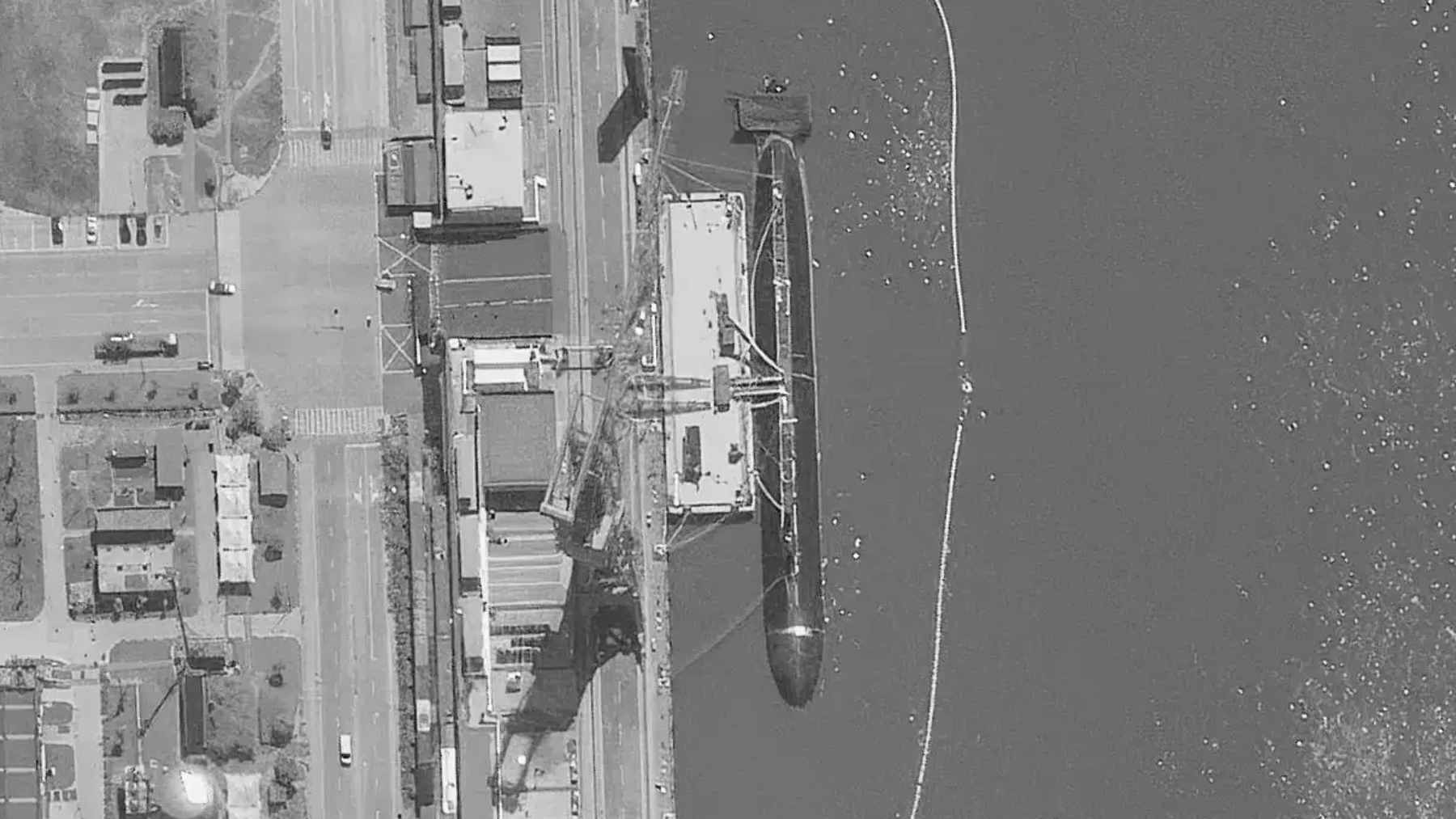 Satellite imagery of an unidentified low-profile Chinese submarine moored at the Jiangnan Shipyard in Shanghai.