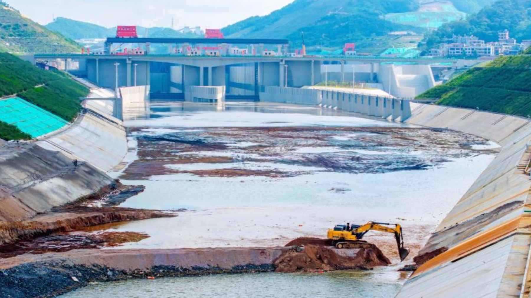 Aerial view of the Pinglu Canal construction site showing the waterway and modern lock infrastructure near the Beibu Gulf.