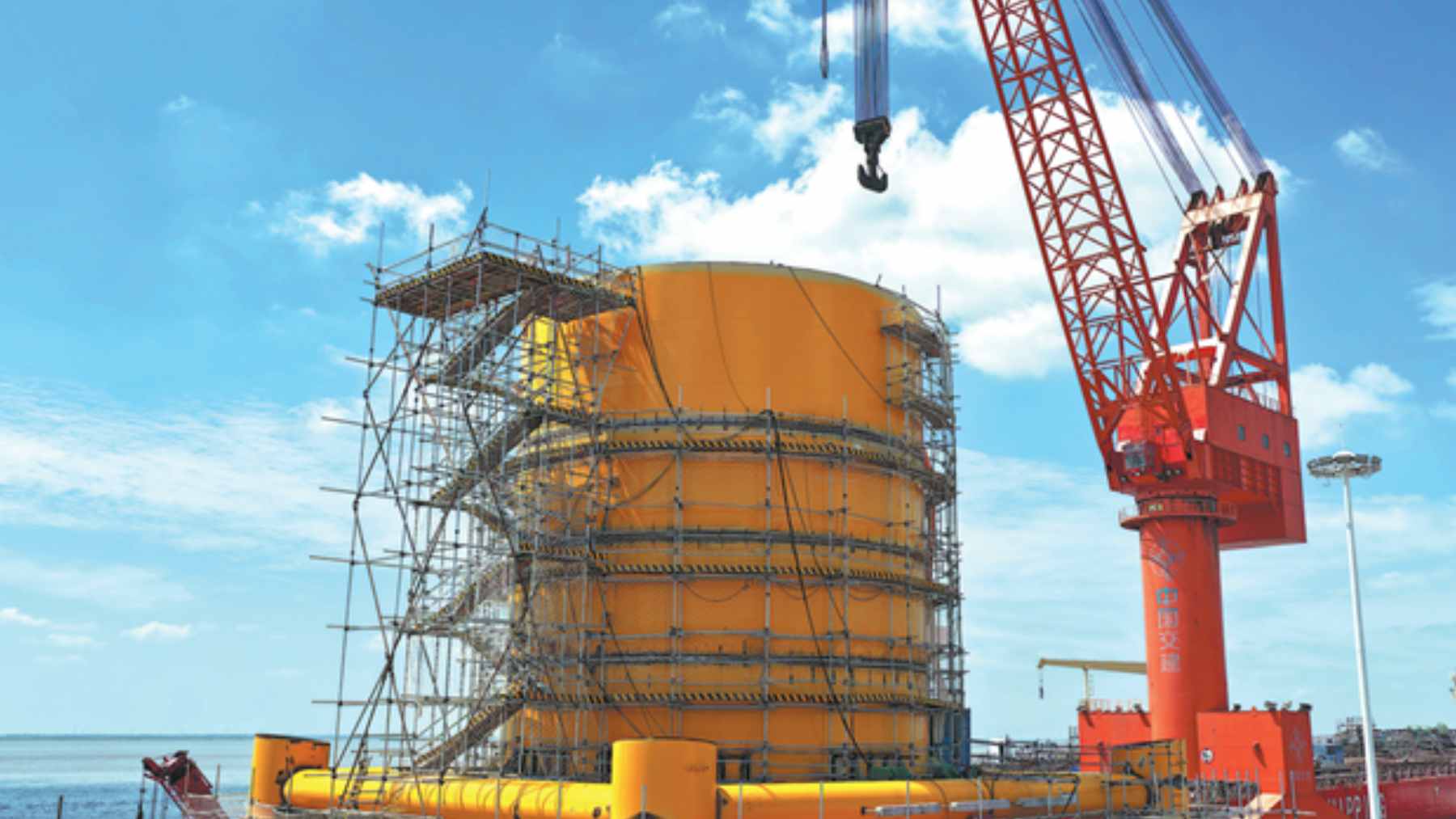 An undersea data center module being submerged off the coast of Shanghai to utilize natural seawater cooling.