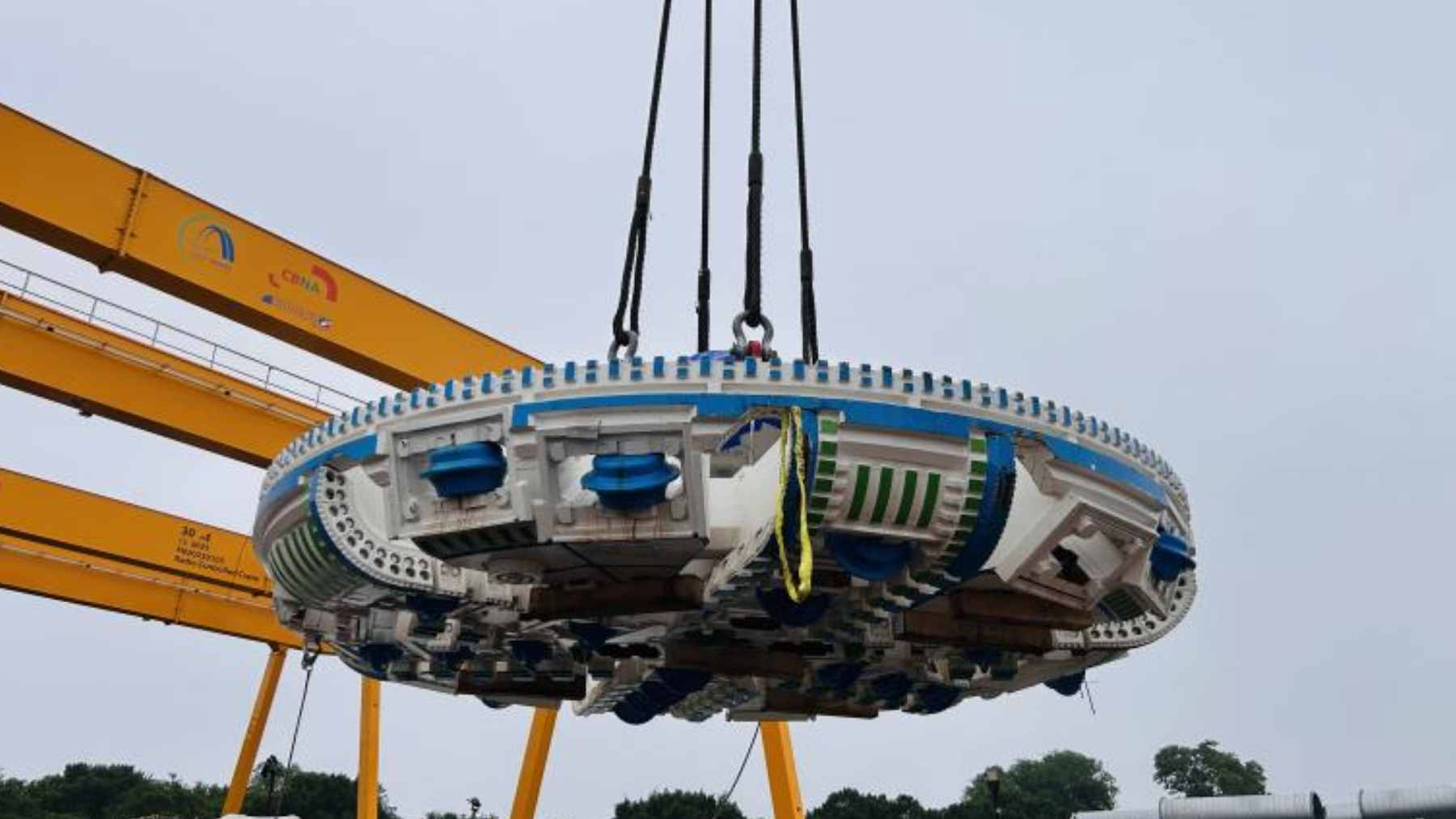 A massive tunnel-boring machine named "Emily" being prepared for excavation at a construction site in West Potomac Park, Washington, D.C.