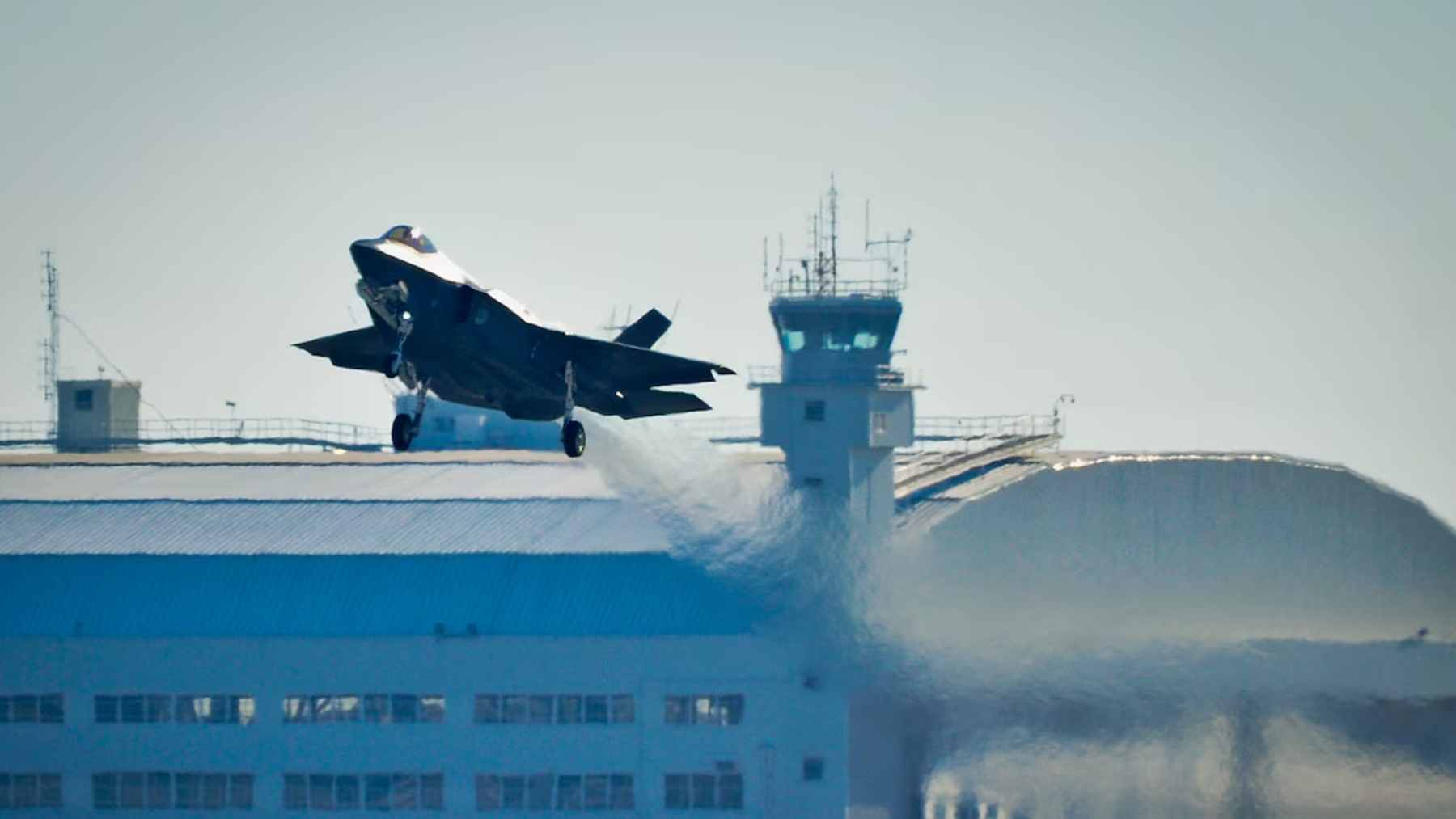 A U.S. Marine Corps F-35B Lightning II fighter jet undergoing maintenance and digital system upgrades at Fleet Readiness Center East.