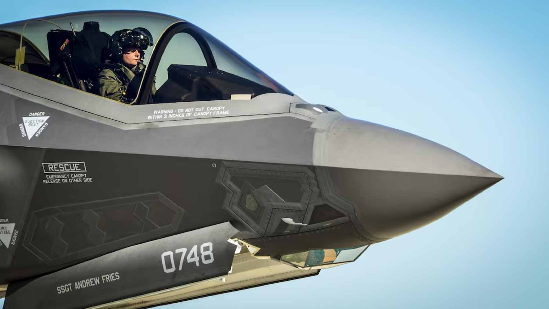 U.S. Marine Corps personnel inspect the advanced cockpit and avionics bay of an F-35B Lightning II during its Technology Refresh 3 (TR-3) conversion at FRC East.