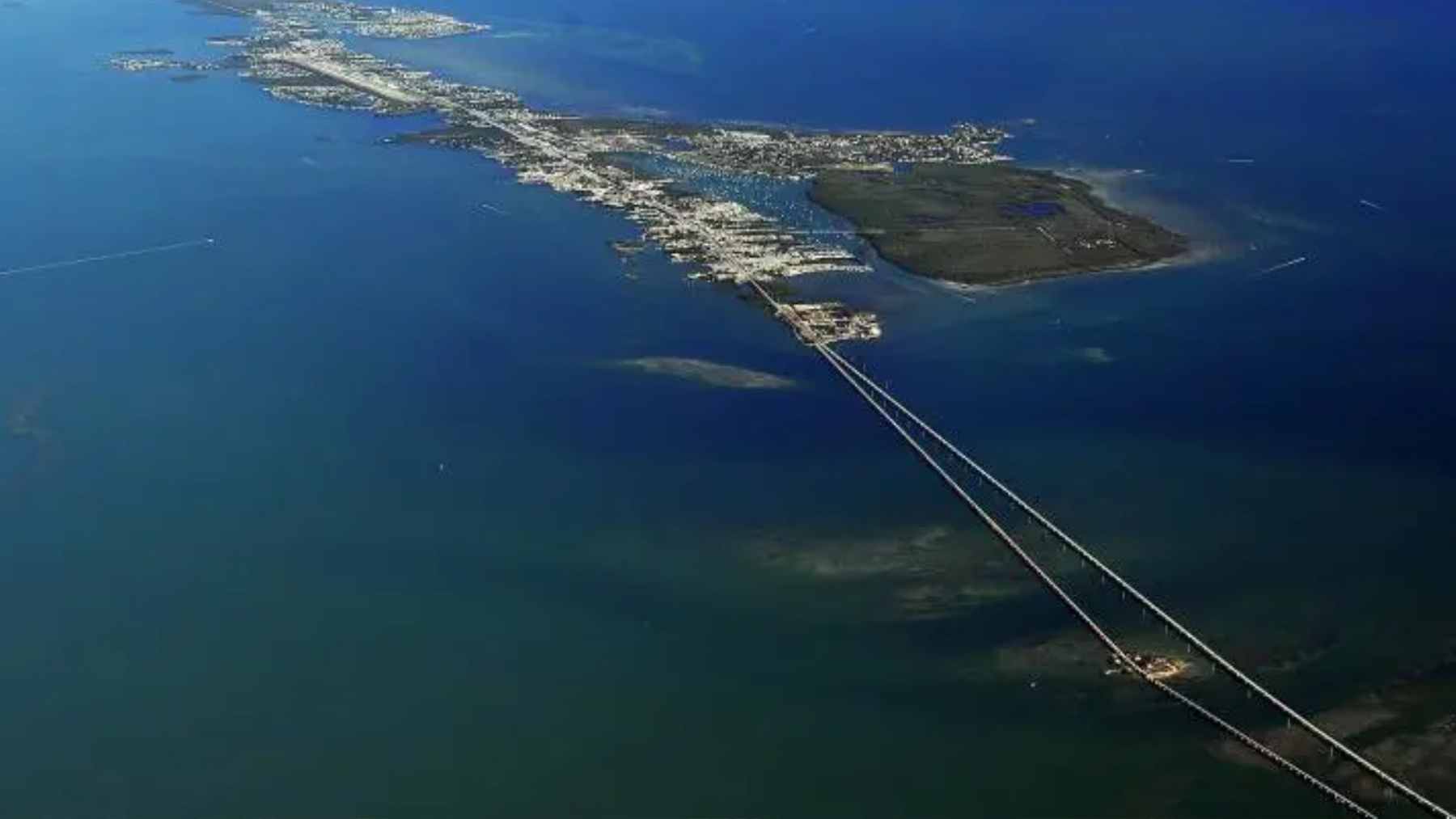 The iconic Seven Mile Bridge stretching across the turquoise waters of the Florida Keys, showcasing the Overseas Highway.