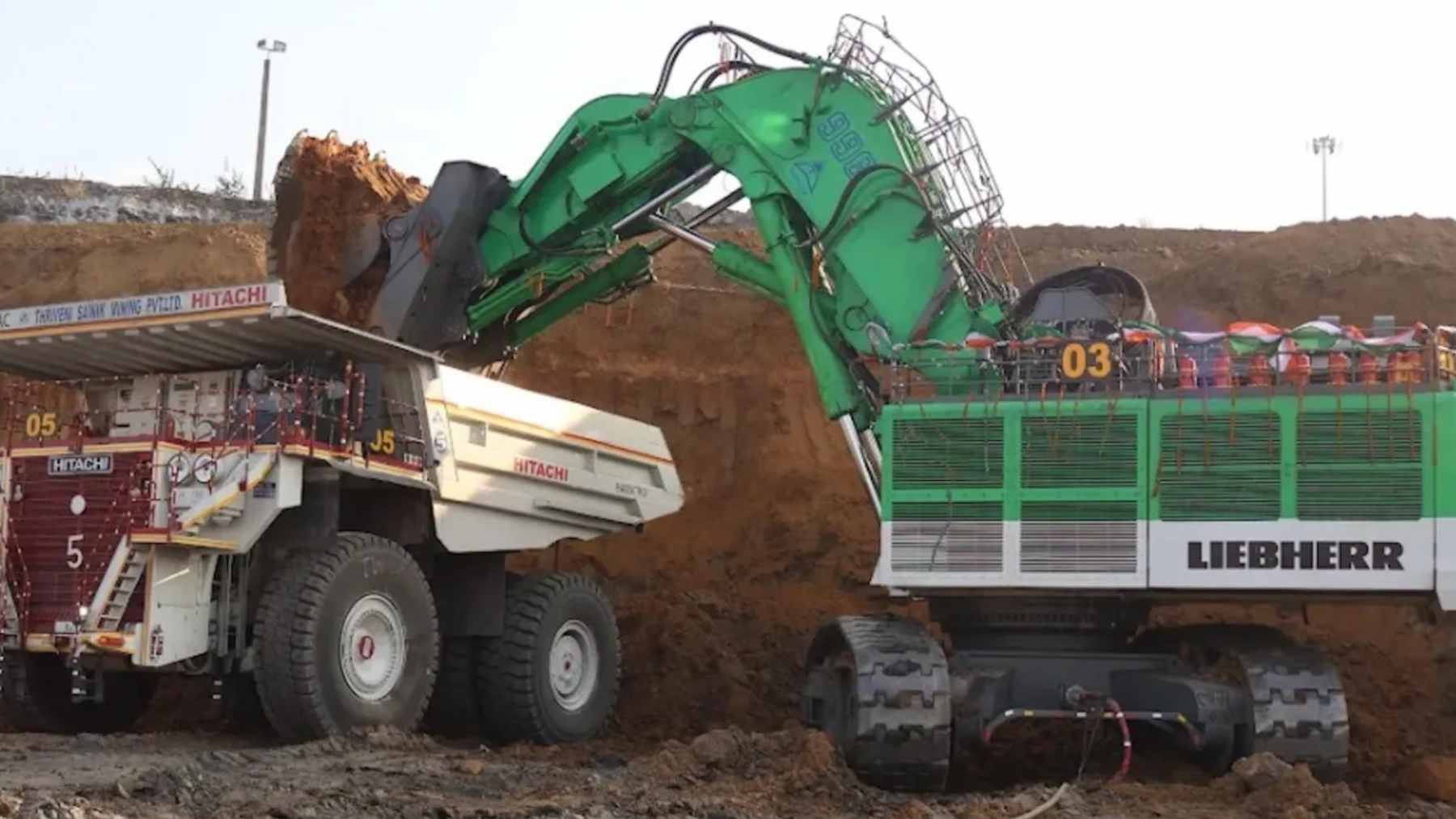 A massive electric-converted mining excavator operating in an open-pit mine, showing the power and scale of the new electric architecture.