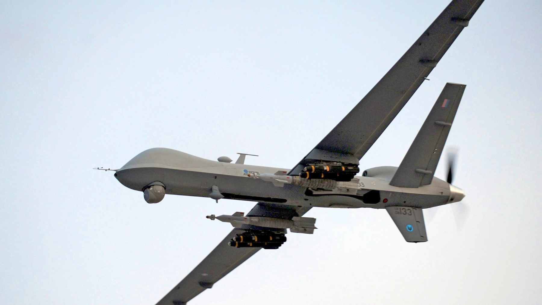 A concept graphic showing an integrated air defense network protecting a radar installation with autonomous interceptor drones.