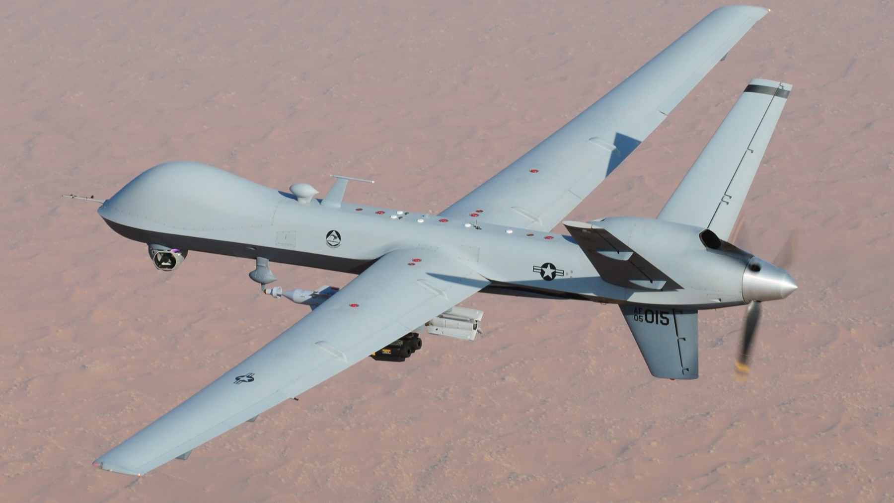 A concept graphic showing an integrated air defense network protecting a radar installation with autonomous interceptor drones.
