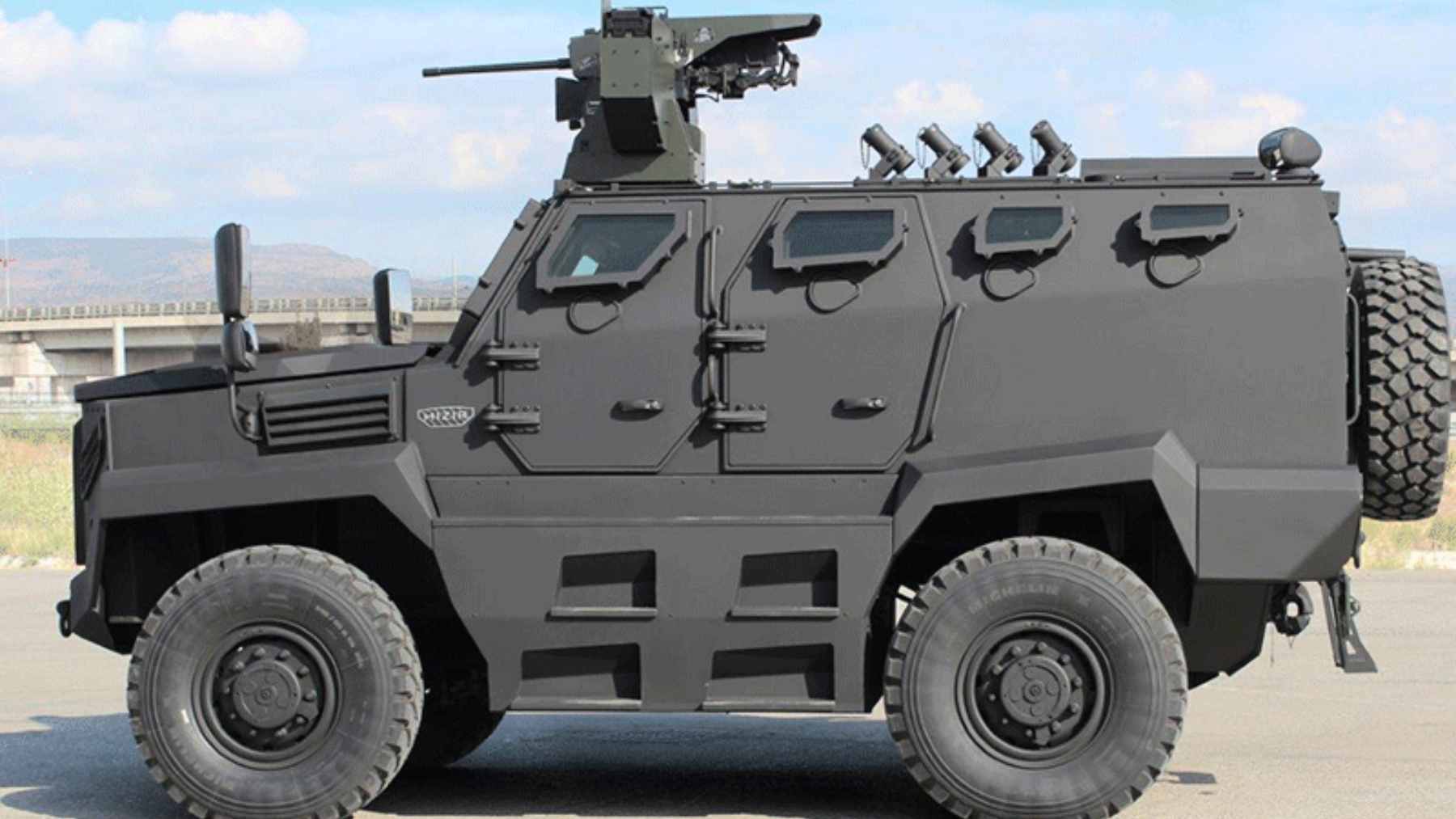 The Katmerciler HIZIR 4x4 MRAP vehicle navigating rough terrain during a military field exercise.