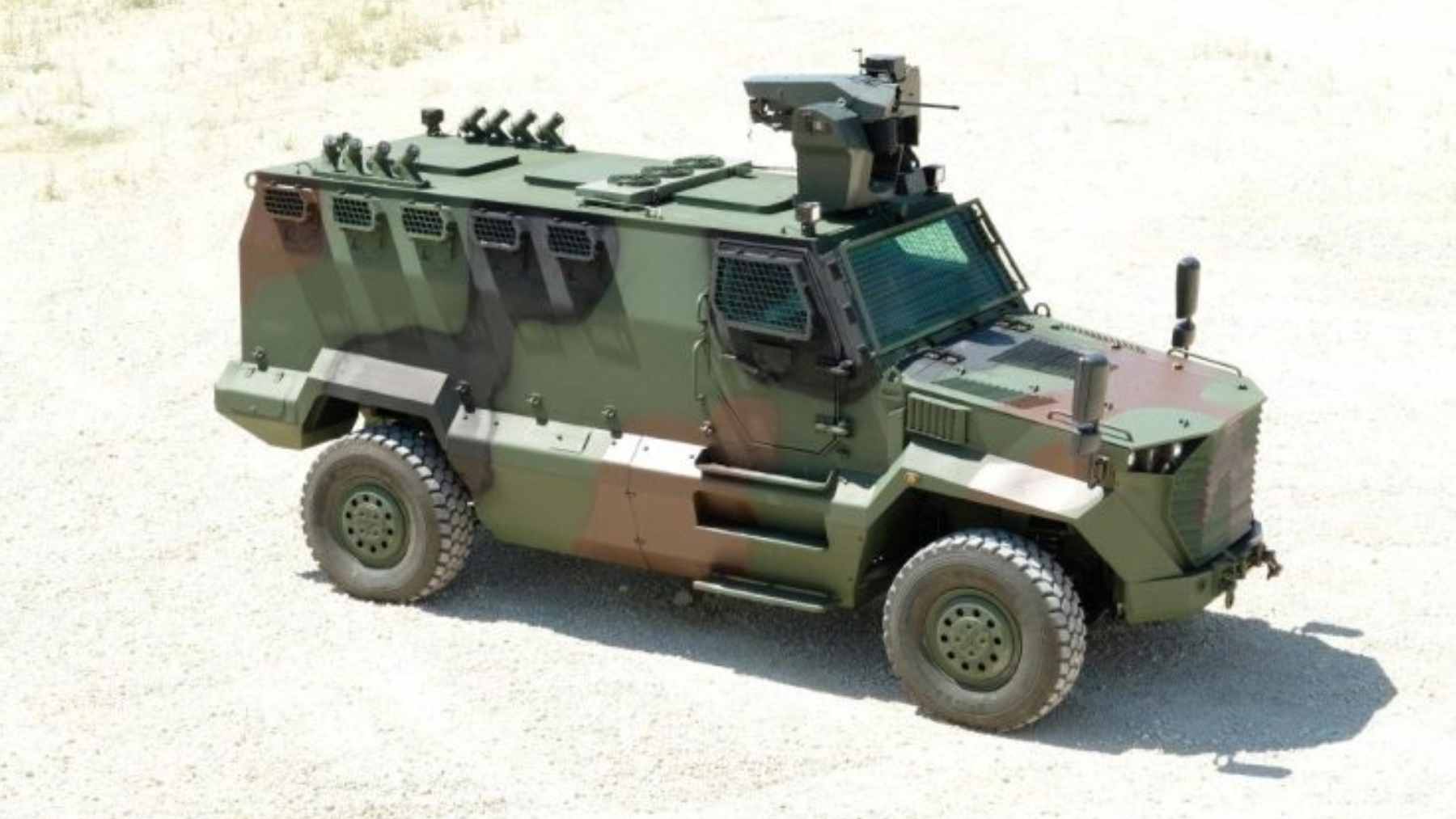 The Katmerciler HIZIR 4x4 MRAP vehicle navigating rough terrain during a military field exercise.
