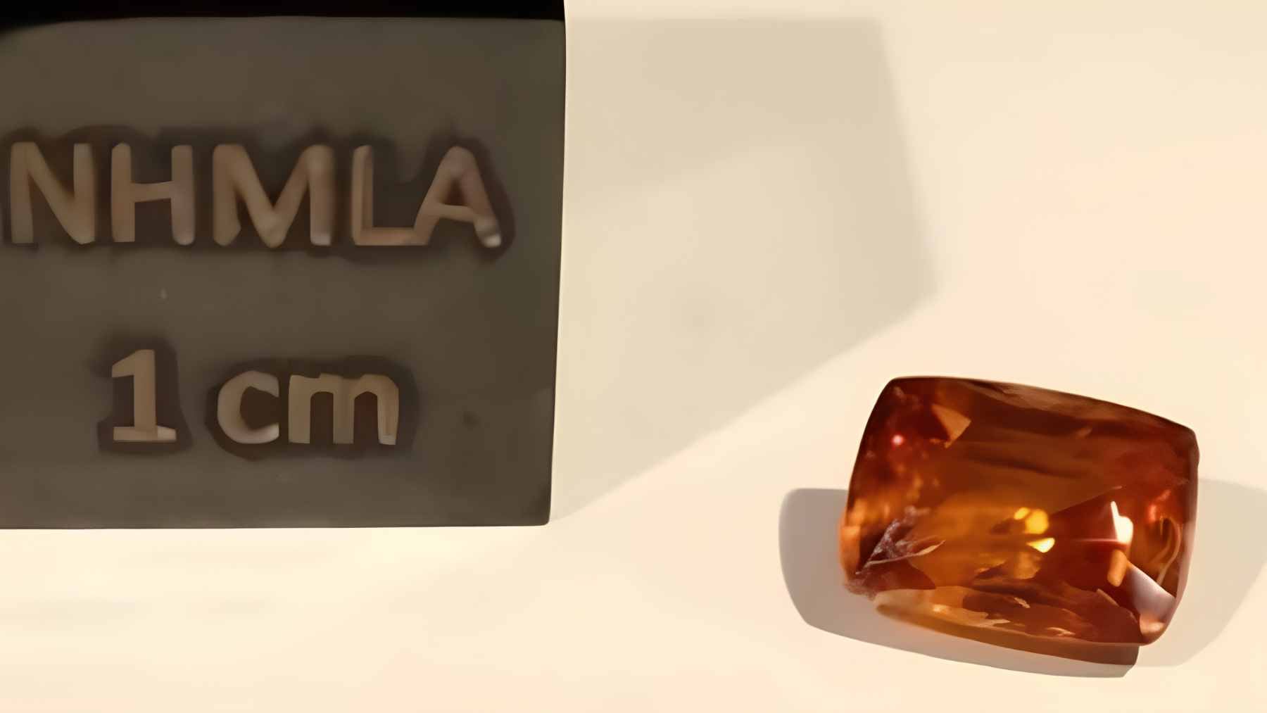Earth’s rarest mineral weighs just 1.61 carats, and the single crystal from Myanmar shows how fragile science’s catalog still is 1 A close-up, high-resolution photo of the world’s only known natural kyawthuite crystal, faceted into a reddish-orange 1.61-carat gem.