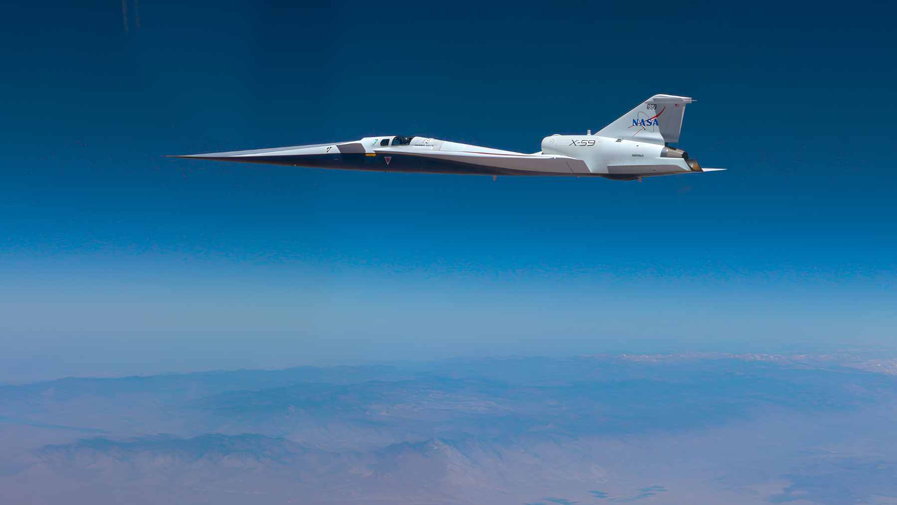 NASA's experimental X-59 quiet supersonic aircraft performing a test flight to validate its noise-reduction technology.
