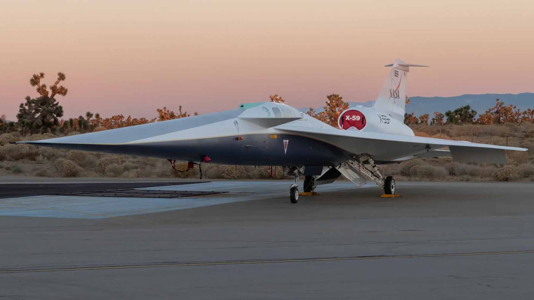 NASA’s experimental X-59 research aircraft in flight, featuring its long, slender nose designed to reduce sonic booms.
