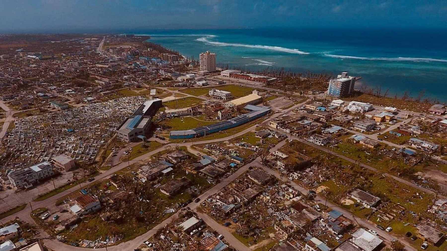 A residential rooftop solar array featuring storm-durable mounting hardware designed to withstand typhoon-force winds in the Northern Mariana Islands.