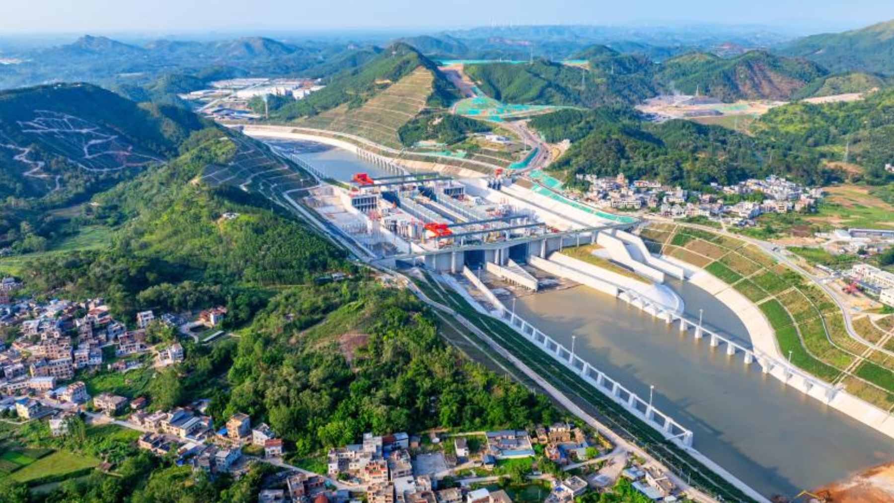 An aerial view of the Pinglu Canal lock system during its final preparation phase, showcasing the engineering scale of the new waterway.
