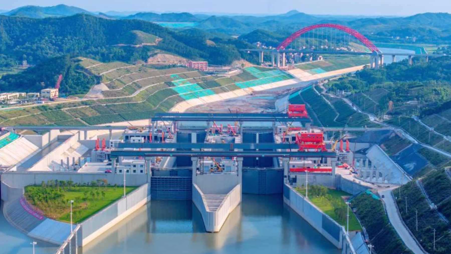 An aerial view of the Pinglu Canal lock system during its final preparation phase, showcasing the engineering scale of the new waterway.