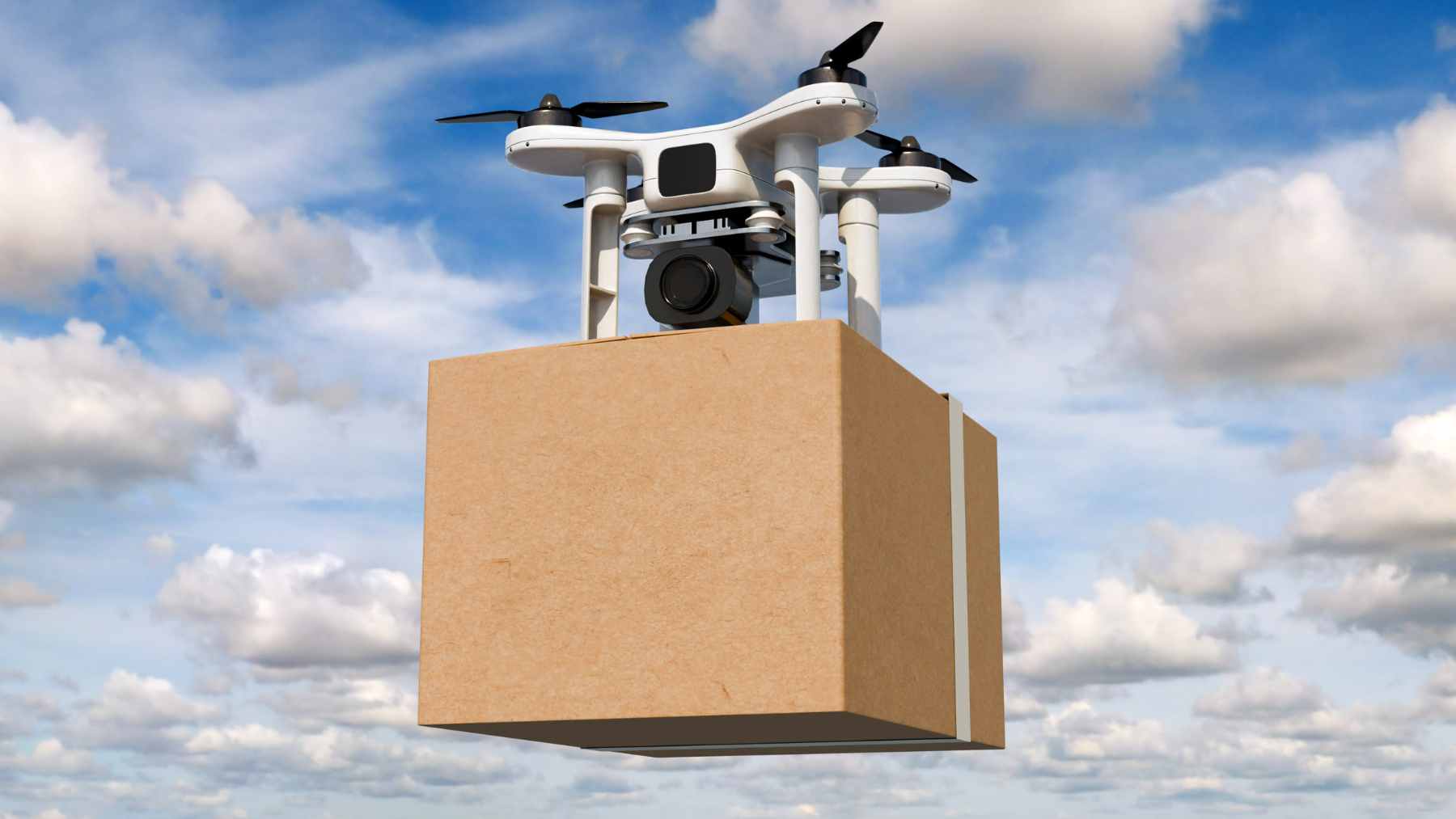 A small, specialized delivery drone navigating over an urban business park to drop off pharmaceutical supplies.