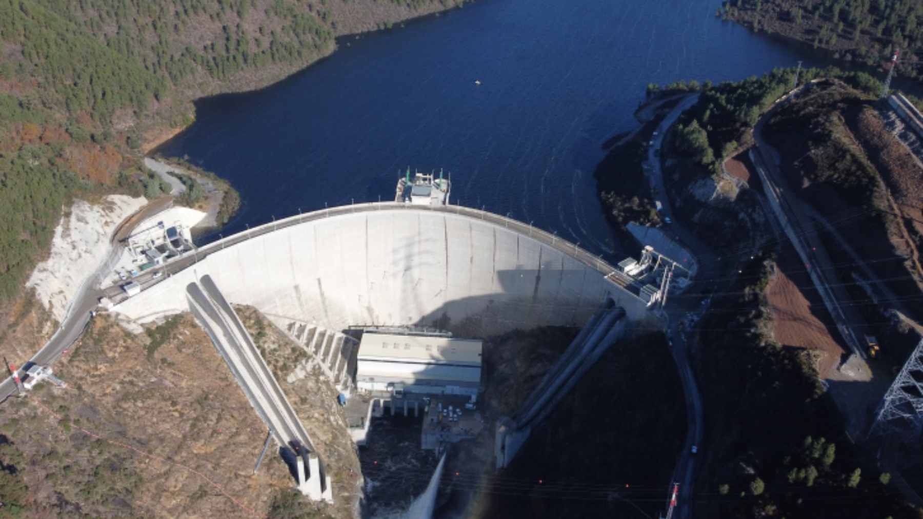 Aerial view of the Tâmega hydroelectric complex in Portugal, showing the massive dams used for pumped-storage renewable energy.