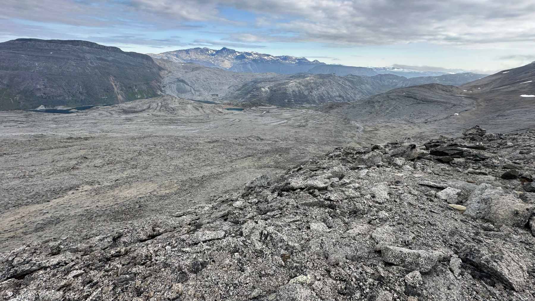 A panoramic aerial view of the Tanbreez rare earth mining site in southern Greenland, highlighting the region's rugged Arctic landscape.