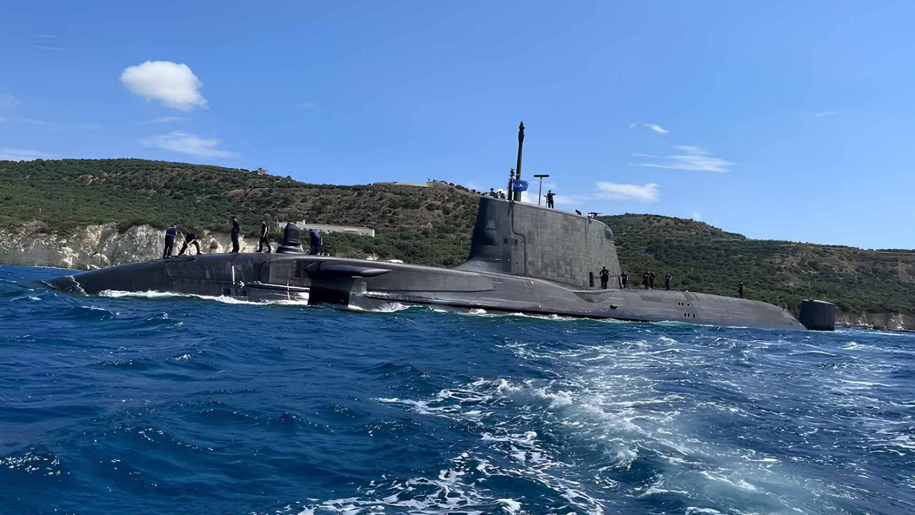 A British attack submarine enters repairs, and the timing exposes how fragile underwater readiness has become for NATO navies 1 A Royal Navy Astute-class submarine moored at a naval facility during a period of maintenance and repair.