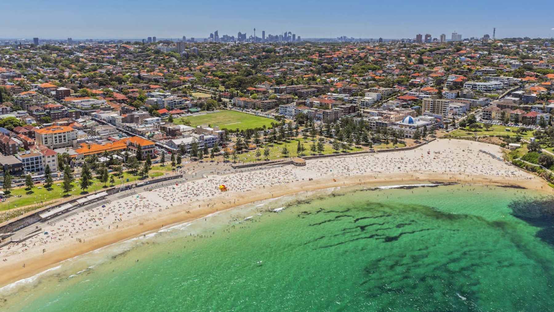 Shark bites are forcing Australia to choose between culls and sensors, and the safer answer may already be flying over the water 1 A surf lifesaver piloting a drone over a beach to monitor coastal waters for shark activity.