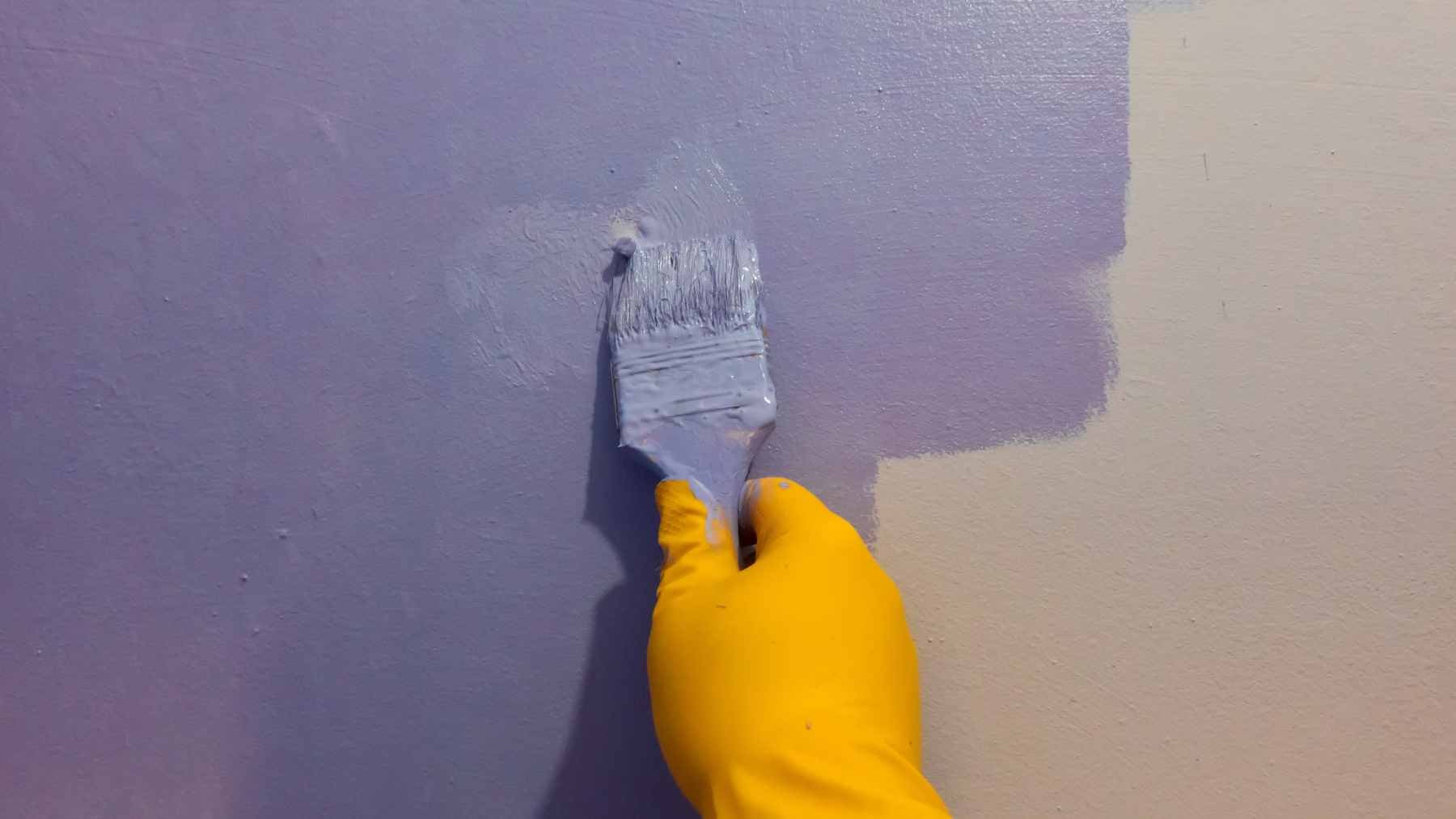 A close-up view of the white polymer smart paint applied to a roof surface, demonstrating its sunlight-reflective properties.