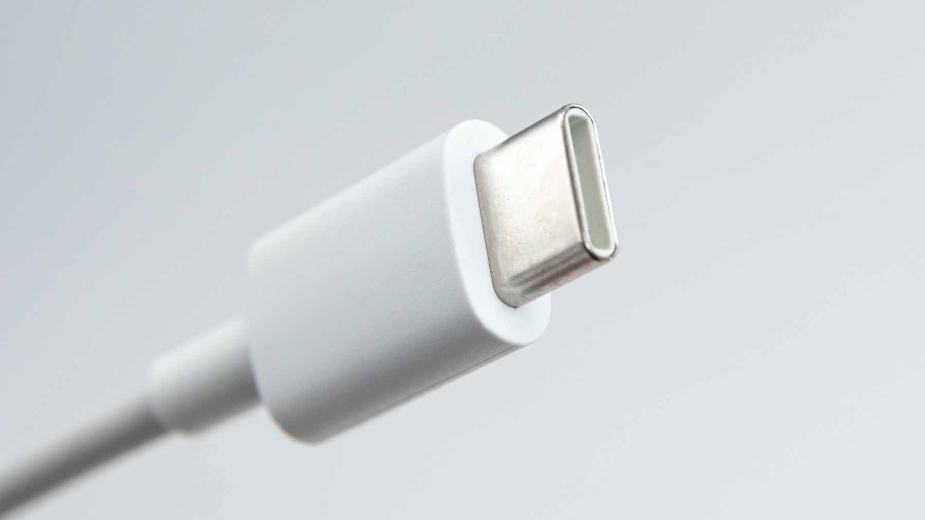 Close-up of a USB-C connector showing the pins that manage data and power, highlighting why contact quality is vital for charging speed.
