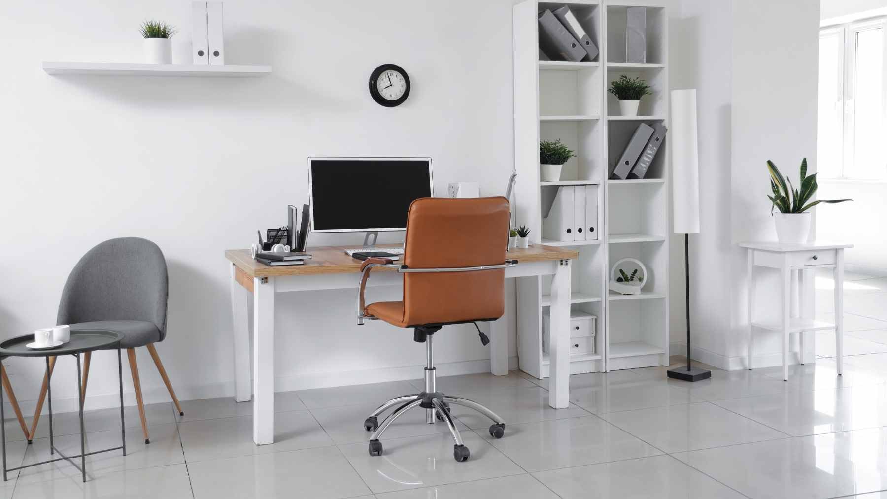 Twelve gadgets under $25 that could quietly fix the home office you threw together on the fly 2 A neat home office desk setup featuring a laptop stand, keyboard, and organizing accessories, representing budget-friendly tech upgrades under $25.
