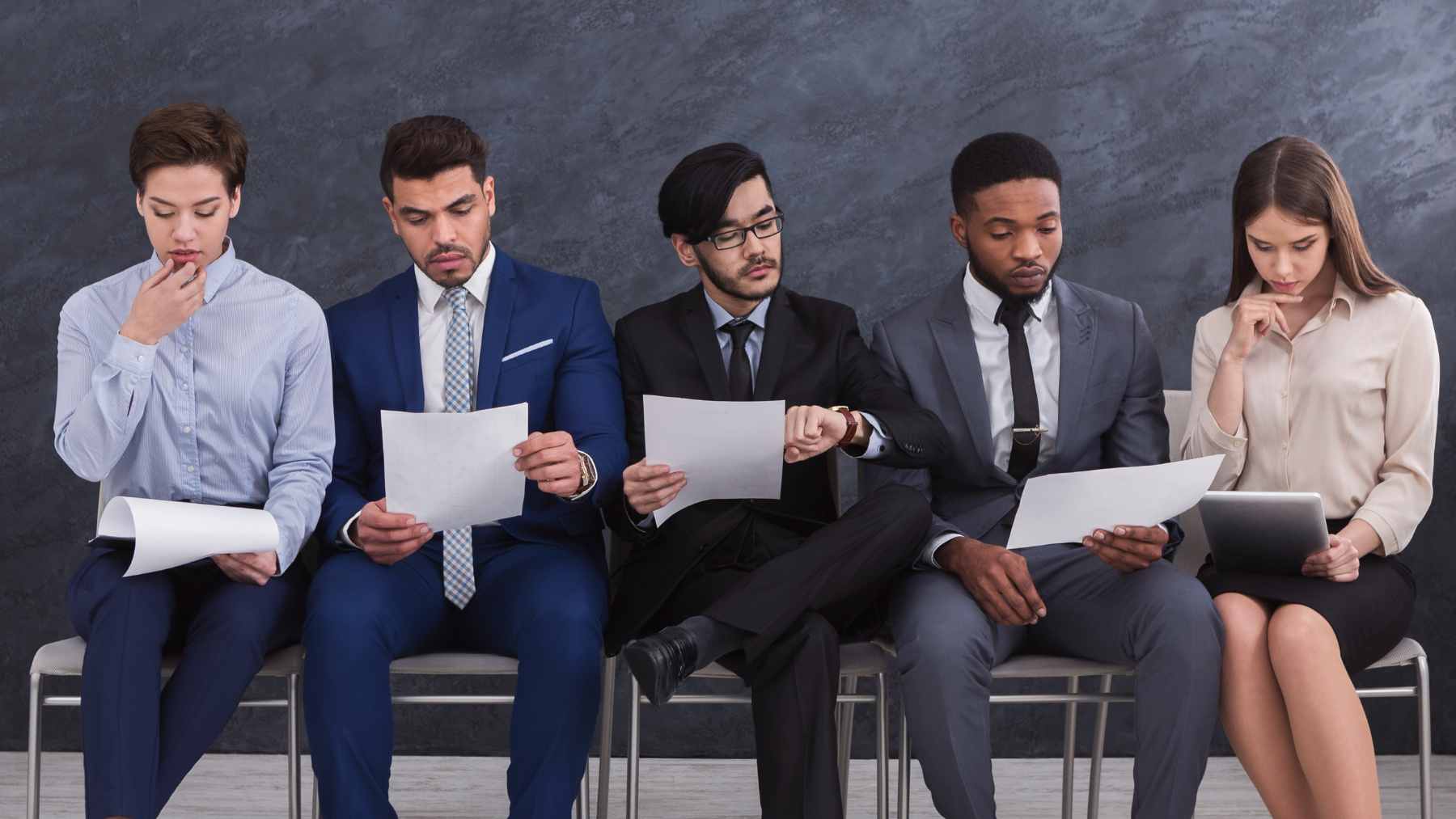 The list of jobs most at risk from artificial intelligence is surprising, as it doesn't start with industrial robots, but rather with translators, writers, historians, call center agents, consultants, and other professionals who make their living through language 2 A professional working on a laptop, surrounded by floating digital icons and AI-generated text, illustrating the integration of artificial intelligence in the workplace.