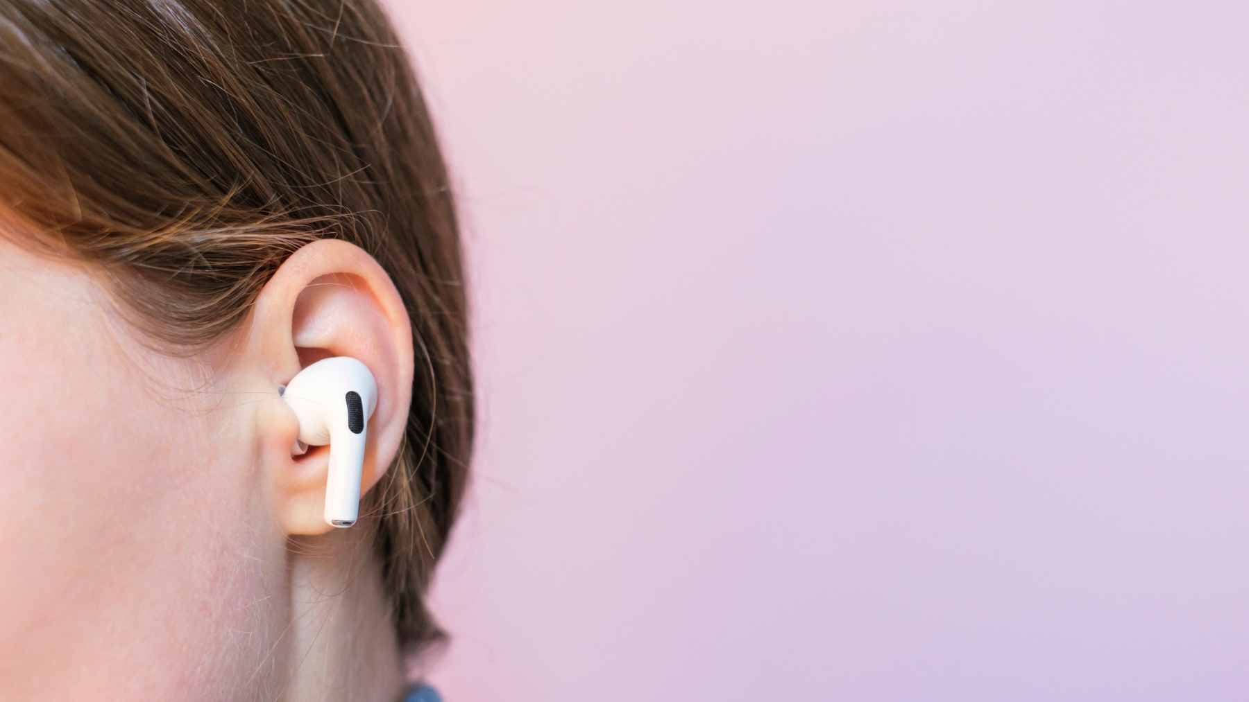 The AirPods Pro 2 and AirPods Pro 3 have become a major topic in the debate over hearing health, as they can reduce loud noise but aren't always a substitute for good concert earplugs 2 A concertgoer wearing AirPods Pro in their ears while standing in a crowd at a live music event.