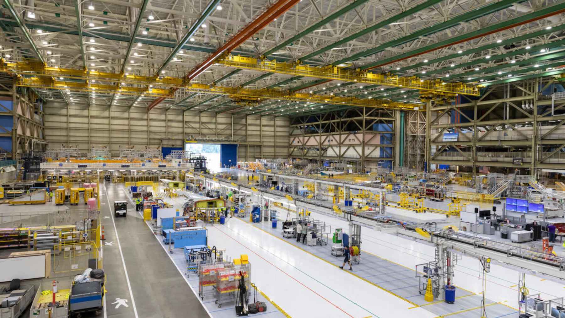 Boeing opened Everett's first 737 MAX line to chip at a backlog of more than 4,300 jets 2 A commercial 737 MAX aircraft on the assembly line, representing Boeing's new manufacturing facility in Everett, Washington.