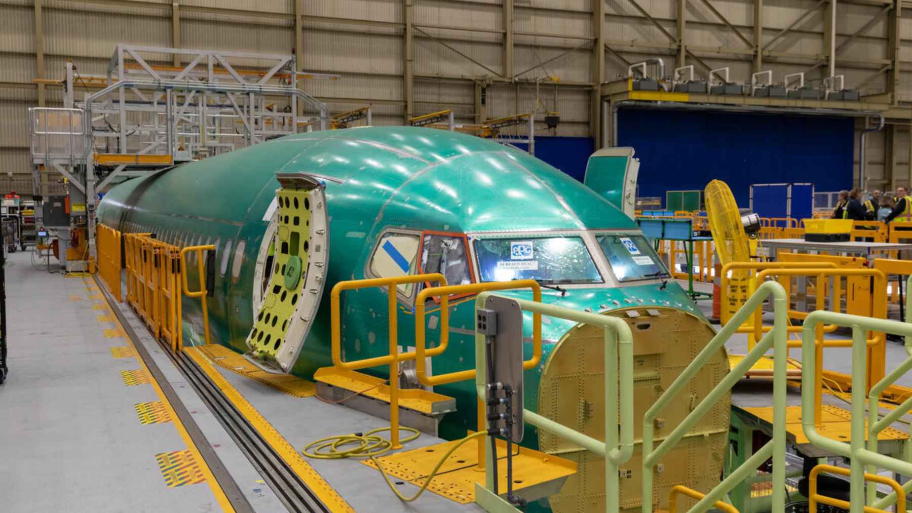 Boeing opened Everett's first 737 MAX line to chip at a backlog of more than 4,300 jets 1 Assembly line workers inside the Boeing facility in Everett, Washington, building a new 737 MAX airplane.
