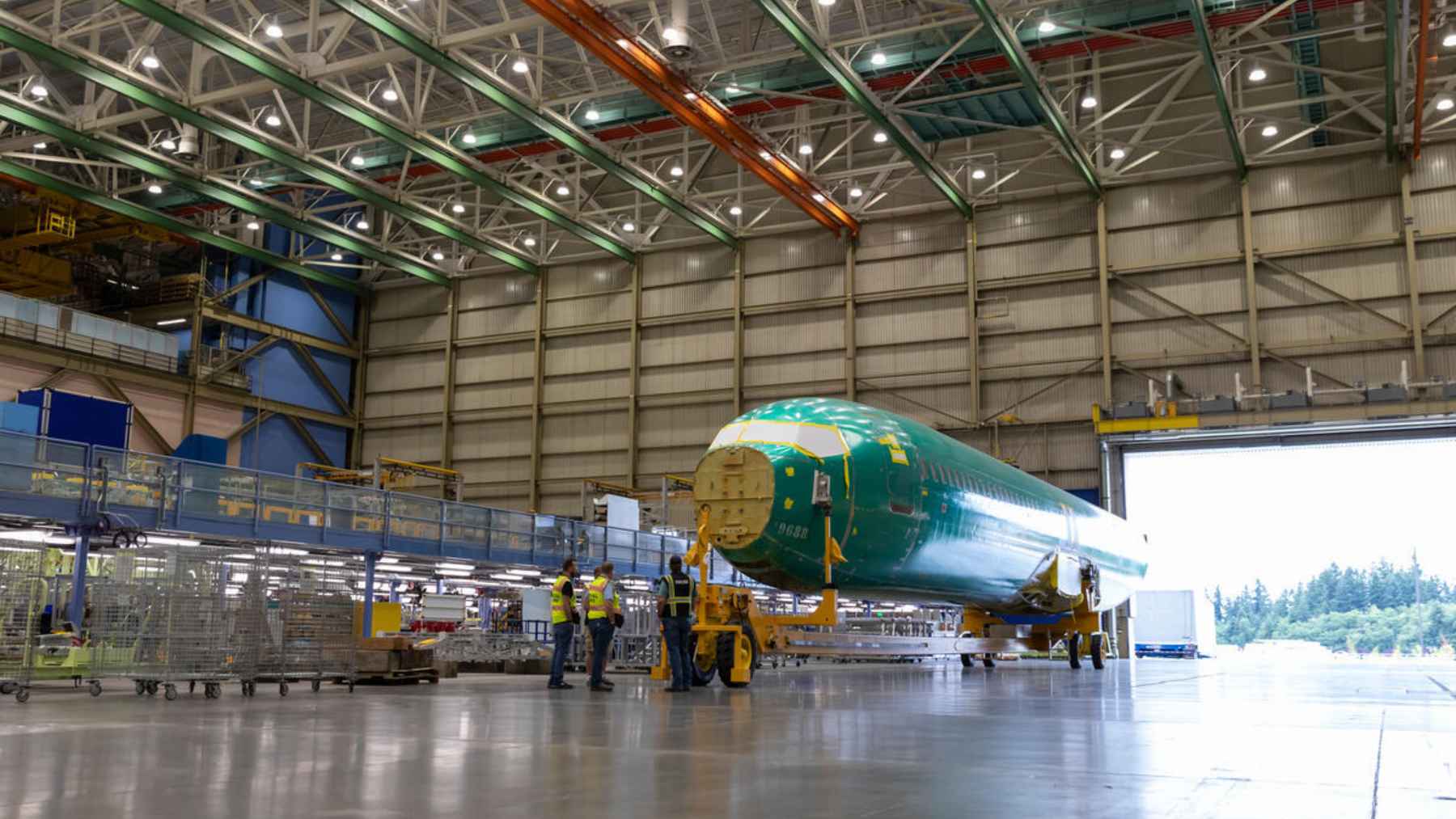 Assembly line workers inside the Boeing facility in Everett, Washington, building a new 737 MAX airplane.