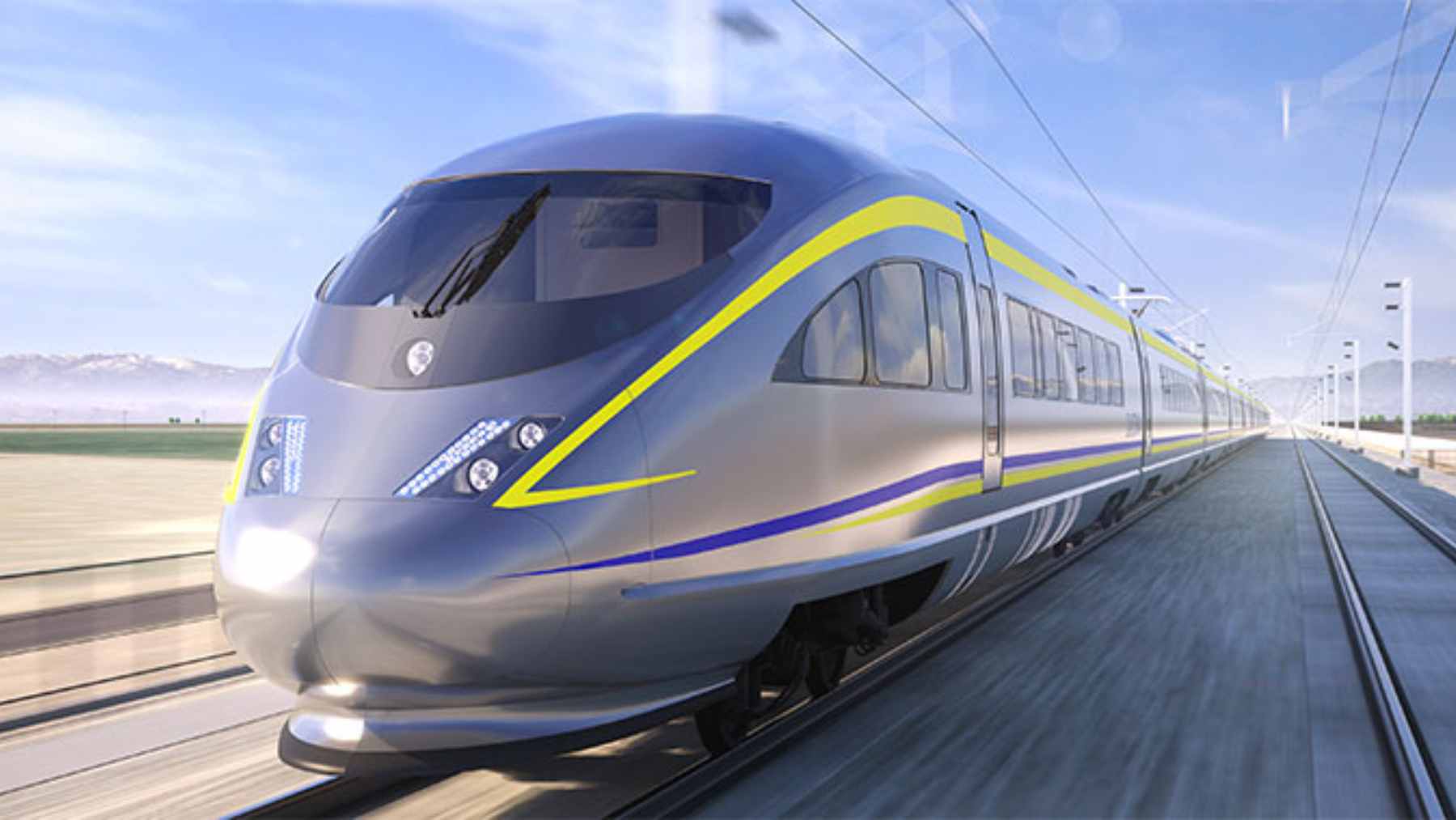 A high-speed rail construction site in California's Central Valley showing completed guideway and ongoing infrastructure development.