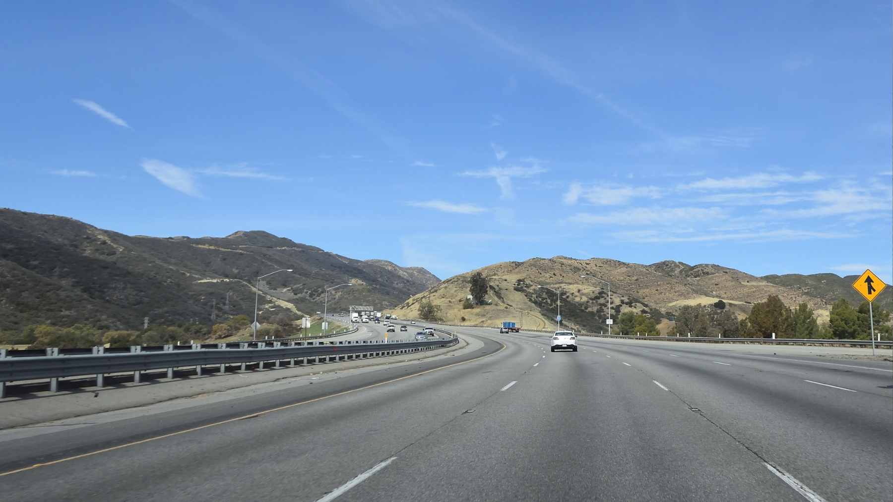 A conceptual view of the Last Chance Grade area, showing the treacherous cliffside coastal road that the new tunnel bypass aims to replace.